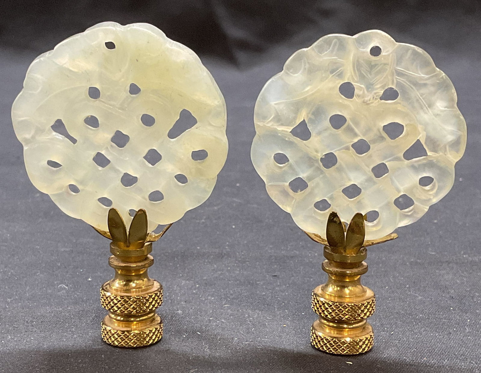 Pair Vintage Carved Stone & Brass Finials: Pair of vintage carved green stone and brass finials. Piece are not attached. Brass pieces have threaded interiors. Stone pieces measure approx 1.75 inches wide. Brass pieces measure approx 1.25 inche
