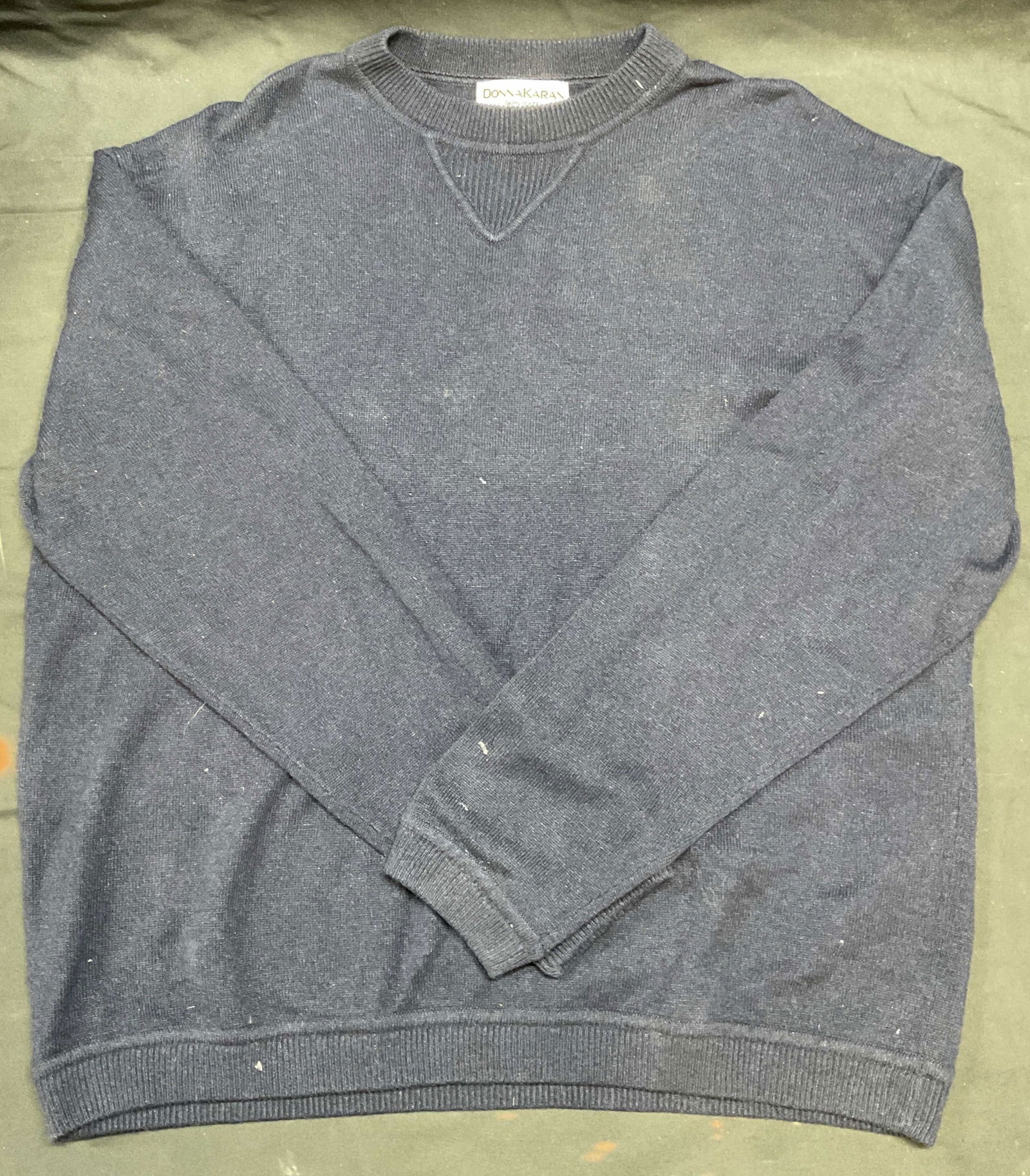 Donna Karan Blue Silk & Cashmere Sweater: Donna Karan blue silk and cashmere blend sweater. Measures approx 22 inches across chest. Some wear including pilling and blemishes observed. Donna Karan, Donna Karan sweater, designer sweater, silk s