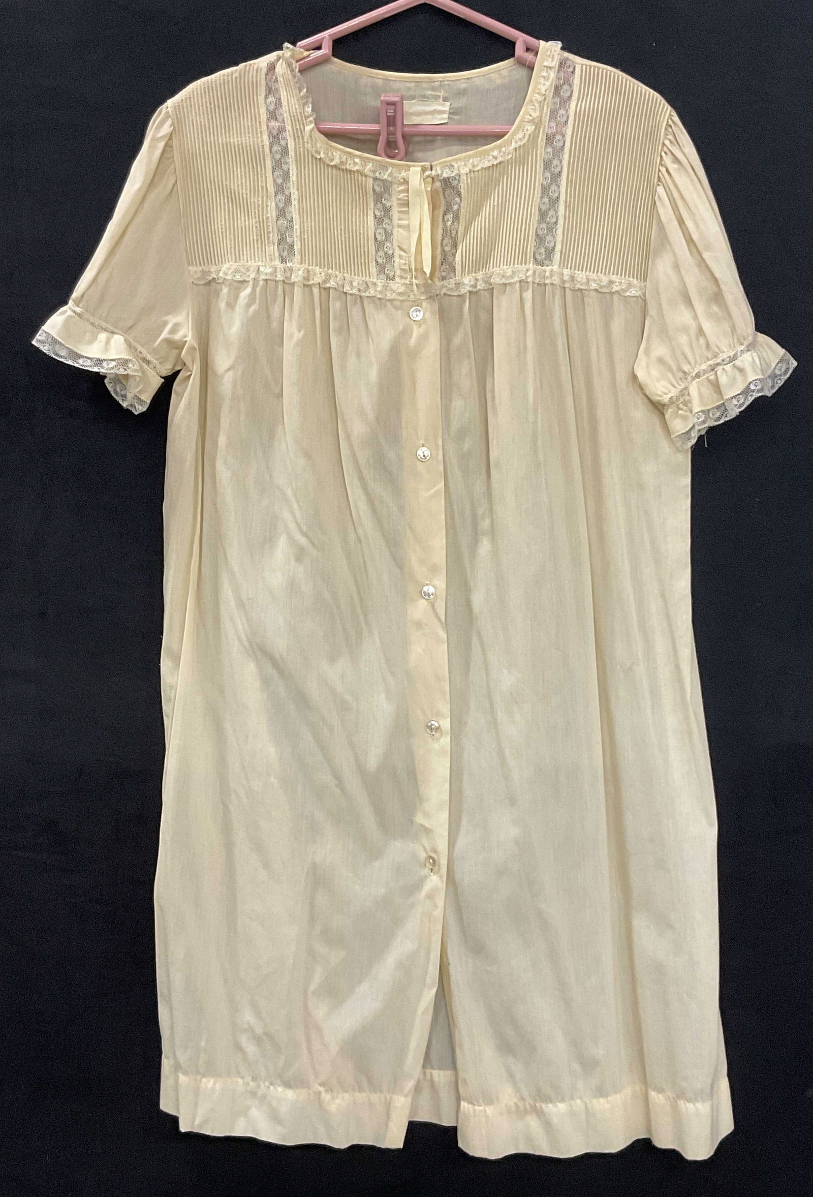 Vintage Yellow Button Up Nightgown: Vintage Yellow Button Up Nightgown. Lace accents to the piece. Button closure. Brand tag is illegible. No size or material tag, crafted from soft hand fabric. Measured flat approx. 37 inches in length