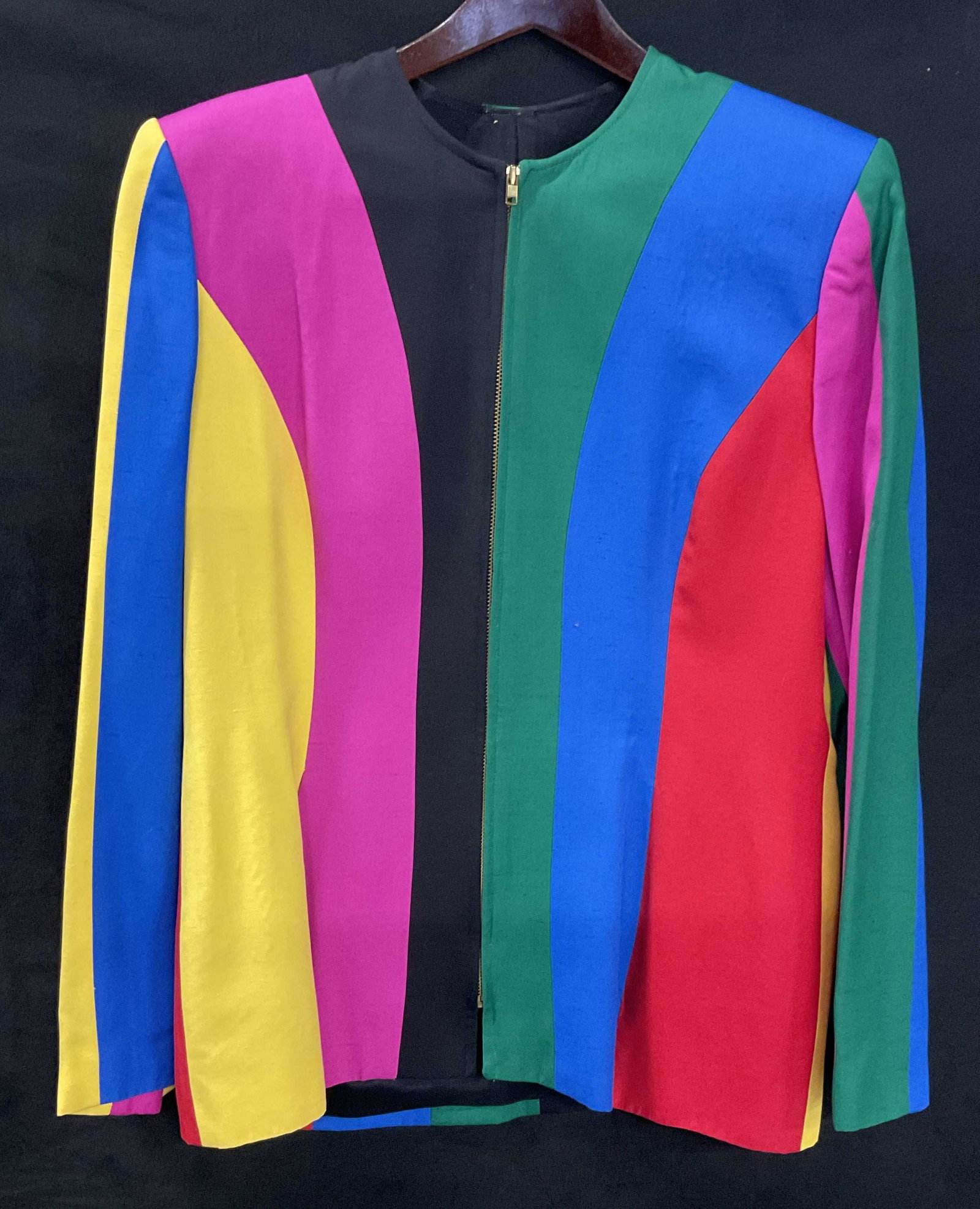 Vintage Multicolored Silk Blend Zippered Cardigan: Vintage Multicolored Silk Blend Zippered Cardigan. Multicolored vertical stripe design. Shoulder padding. Lined interior. Material tag lists a rayon and silk blend. No size or brand tag. Measured flat