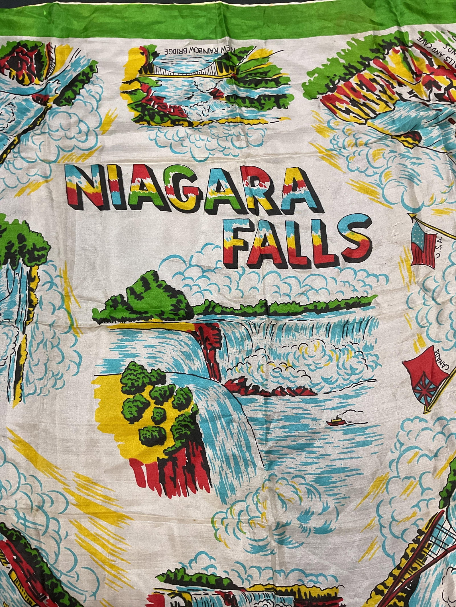 Vintage Niagara Falls Silk Souvenir Scarf: Vintage Niagara Falls silk souvenir scarf in green and white with graphic print. Landmark motif. Measures approx 28 x 28 inches. Wear including blemishes and tearing observed. Scarf, silk scarf, vinta