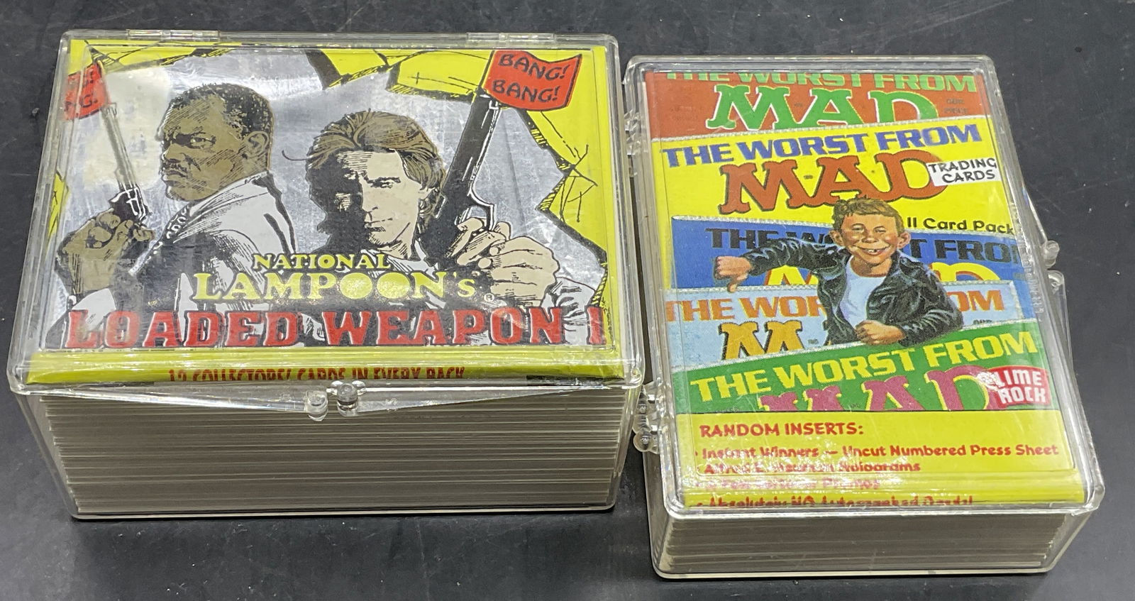 Group Lot Vintage Collectible Trading Cards, MAD +: Group Lot Vintage Collectible Trading Cards. Lot includes C. 1992 LIME ROCK MAD and National Lampoons cards. Not all of the pieces have been examined. Cards are contained in hard plastic cases. The la