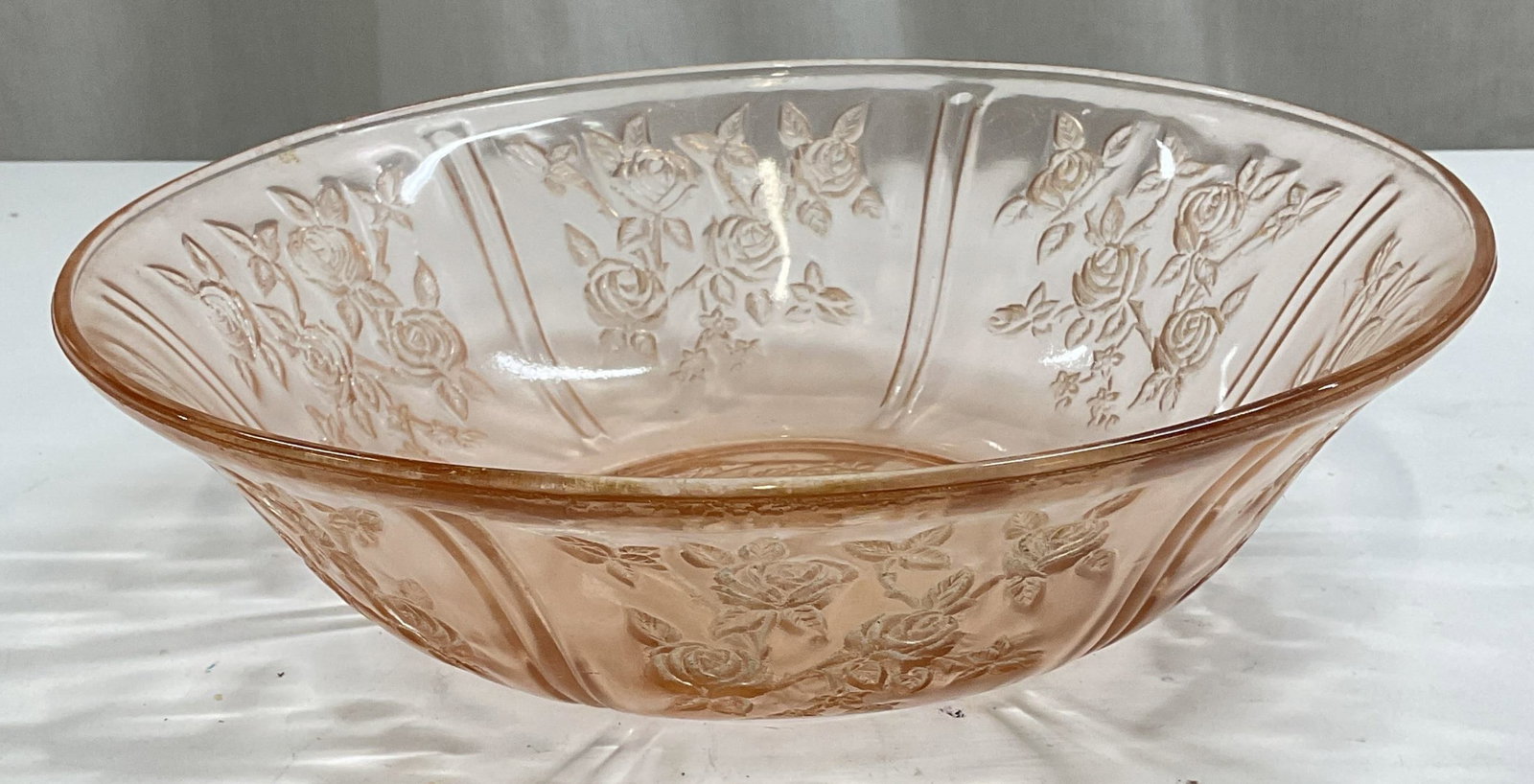 Vintage Pink Floral Depression Glass Bowl: Vintage pink depression glass bowl with floral design. Measures approx 10 x 3 inches. Some wear including scratching observed. Depression glass, depression glass bowl, pink bowl, floral bowl, vintage 
