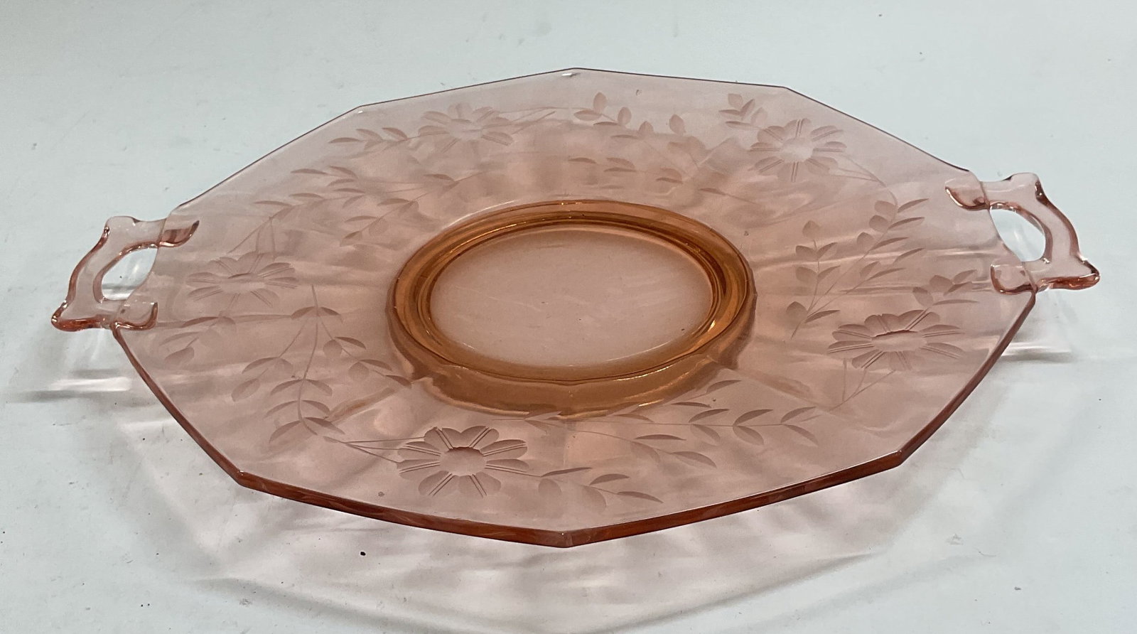 Vintage Pink Depression Glass Floral Platter: Vintage pink depression glass platter with handles and floral design. Measures approx 12 inches wide. Some wear including scratching observed. Depression glass, depression glass platter, pink platter,