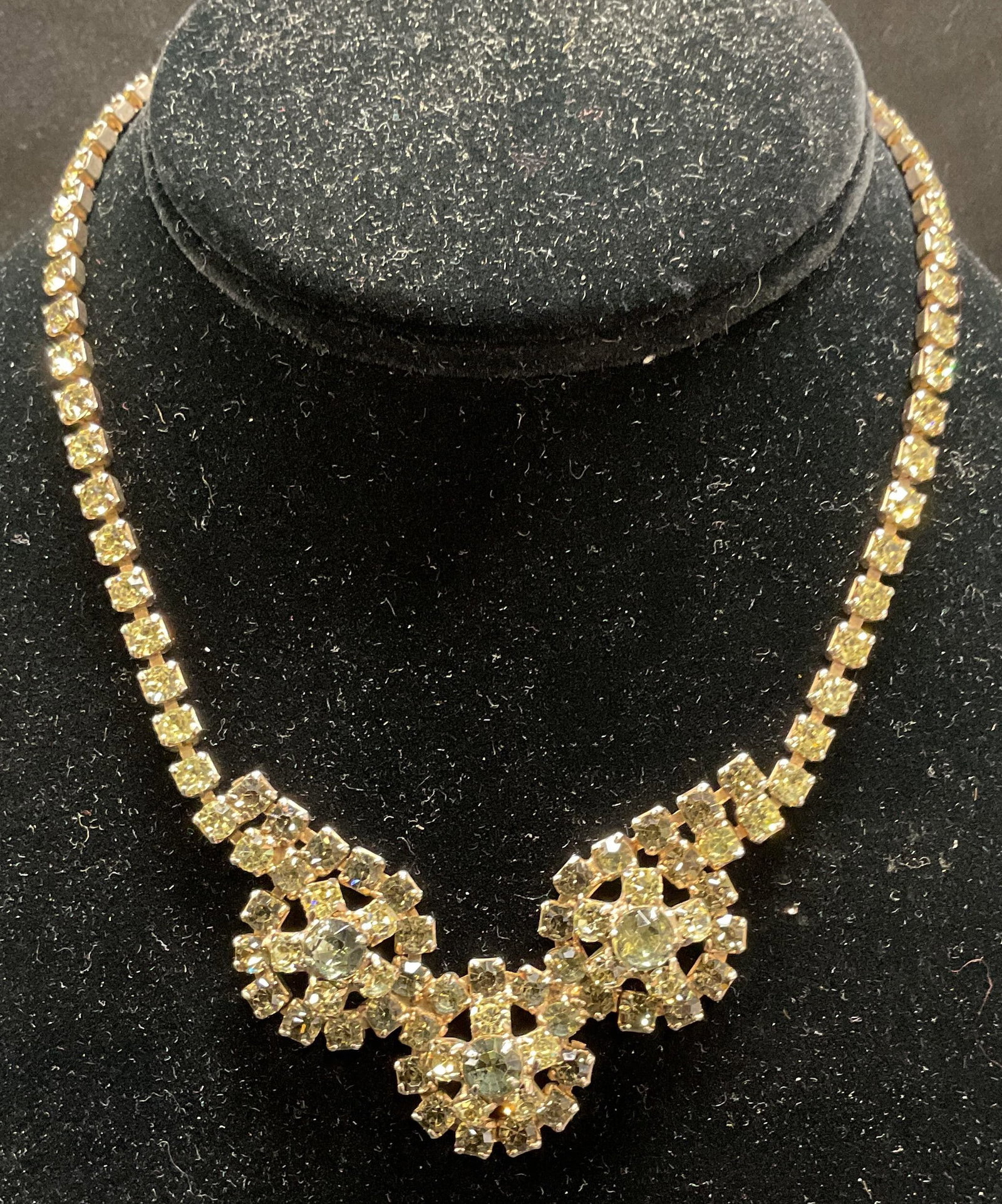 Vintage Green Crystal Pendant Necklace: Vintage gold tone green crystal necklace with round floral design pendants. Drop length approx 6.25 inches. Some wear including scratching observed. Jewelry, estate jewelry, costume jewelry, cocktail 