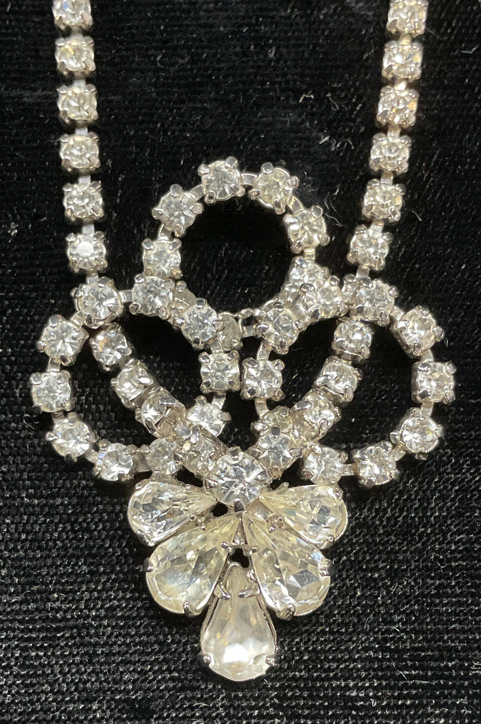 Vintage Silver Tone Crystal Pendant Necklace: Vintage silver tone pendant necklace with colorless crystal decoration. Drop length approx 6 inches. Some wear including scratching observed. Jewelry, estate jewelry, costume jewelry, cocktail jewelry