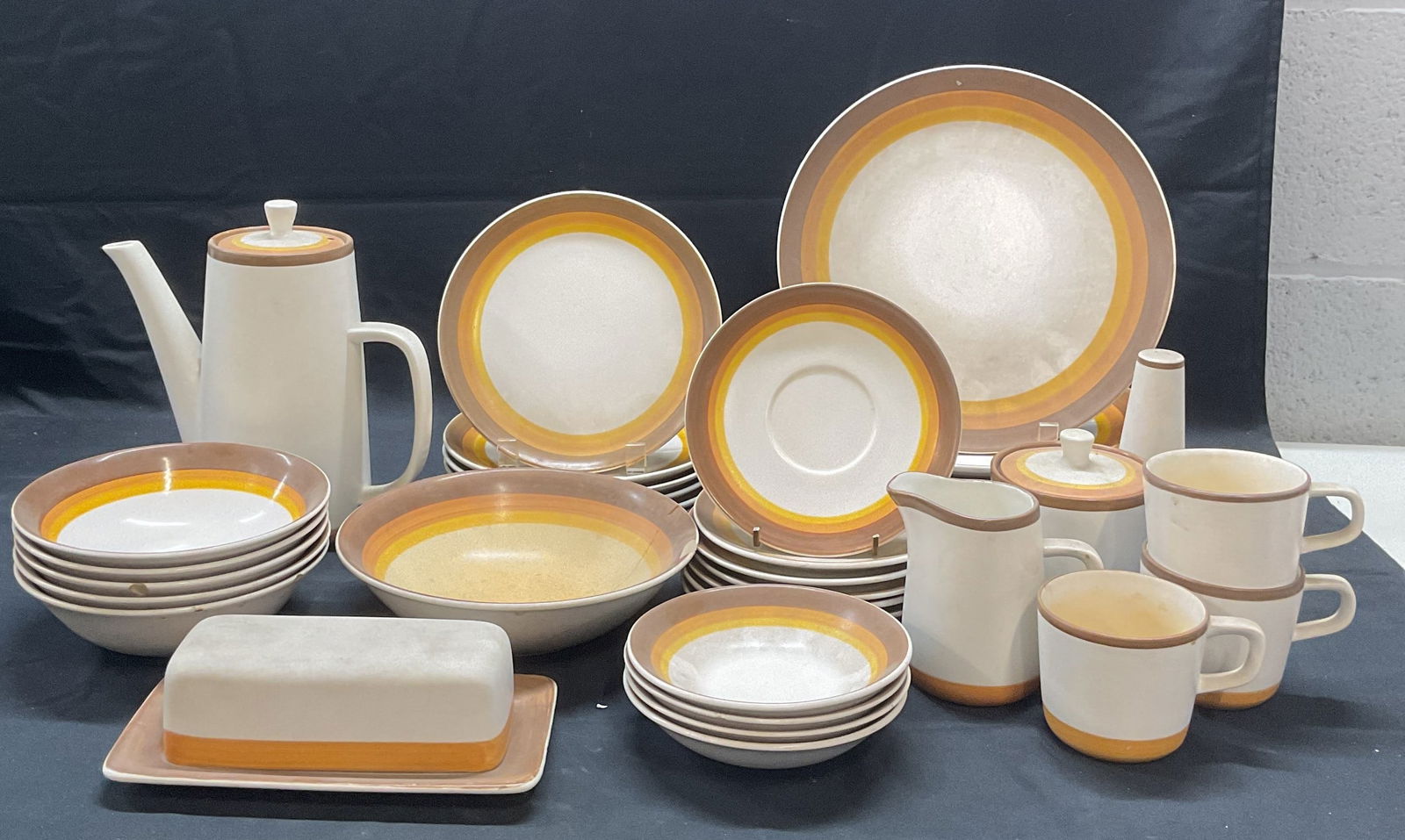 Set38 Vtg MIKASA TerraStone Osage Orange Tableware: Set of 38 pieces vintage MIKASA Terra stone tableware in Osage Orange pattern. Includes 7 dinner plated, 6 luncheon plates, 1 large bowl, 5 soup bowls, 4 dessert bowls, 7 saucers, 1 lidded condiment j