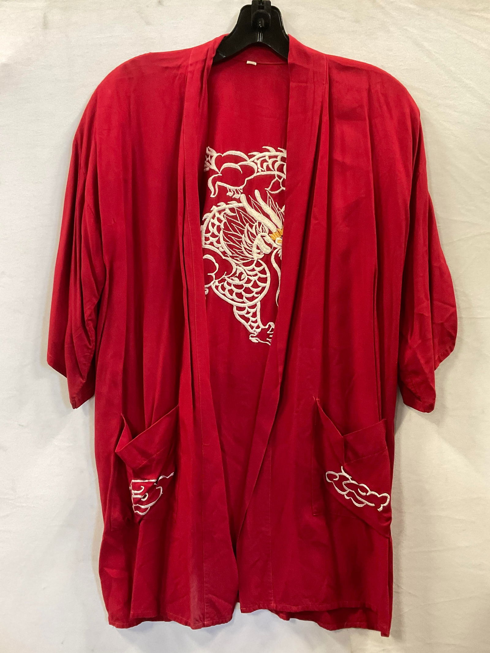Embroidered Dragon Motif Kimono Style Cardigan: Embroidered Dragon Motif Kimono Style Cardigan. Red with white & yellow embroidery dragon to the reverse. Size tag reads S. Embroidered clouds to the front pockets. Length measures approx. 29 inches,