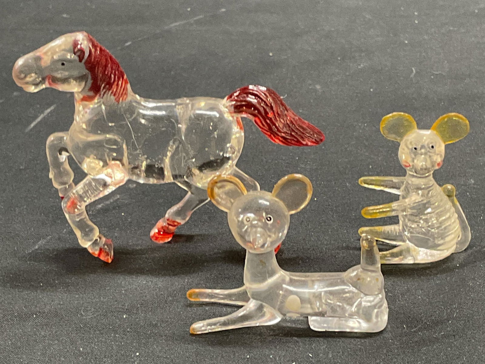 Lot 5 Vtg Art Glass & Lucite Animal Figurals: Lot of 5 vintage animal figurines. Art glass octopus and penguin. Lucite horse, deer, and mouse. Largest approx 2.25 inches tall. All pieces have wear including scratching observed. Octopus needs repa