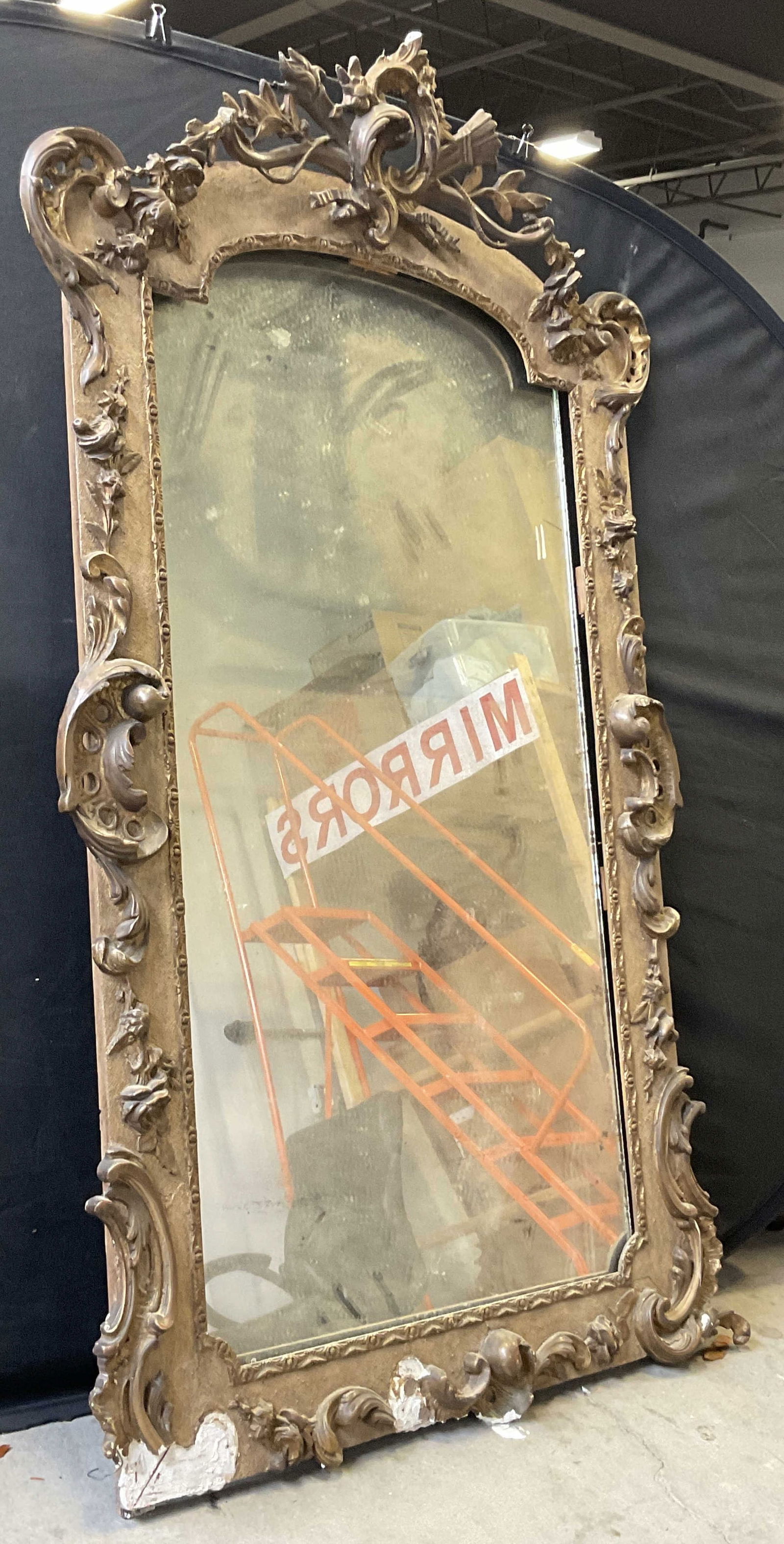 Vintage Wood & Carved Gesso Mirror, 62 Inch Ht: Vintage Wood & Carved Gesso Mirror. Measures approx. 62H x 37.5W in. Weighty. Mirror and backing are not attached to frame. Losses, chipping, residue, and surface wear present. Loose pieces. Wall art,