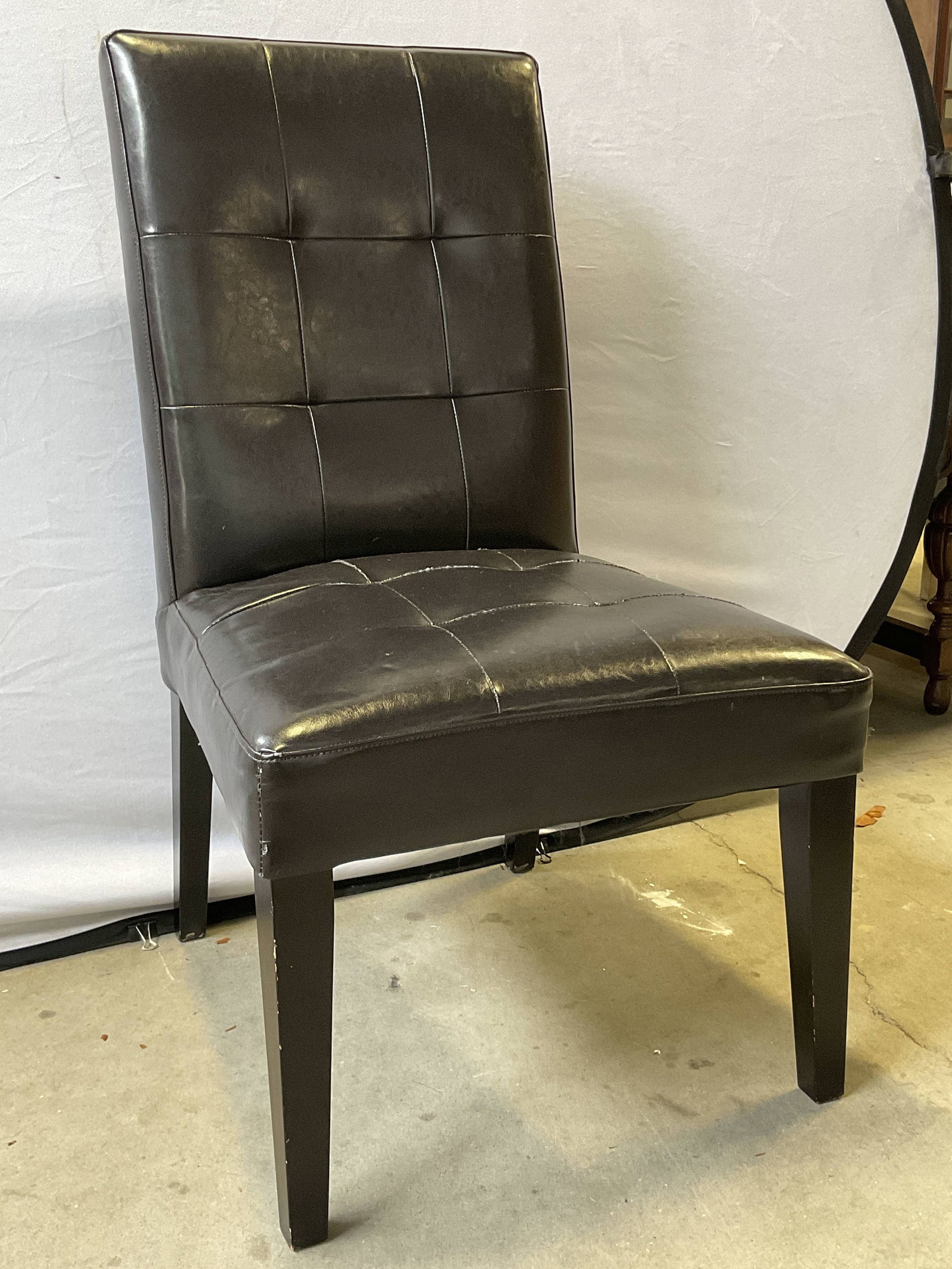 Espresso Toned Leather Side Chair: Espresso Toned Leather Side Chair. Measures approx. 21.5D x 22W x 39H in. Tag to underside. Dated 2011. Surface wear, indentation, loose threads, and discoloration present. home decor, home accents, h