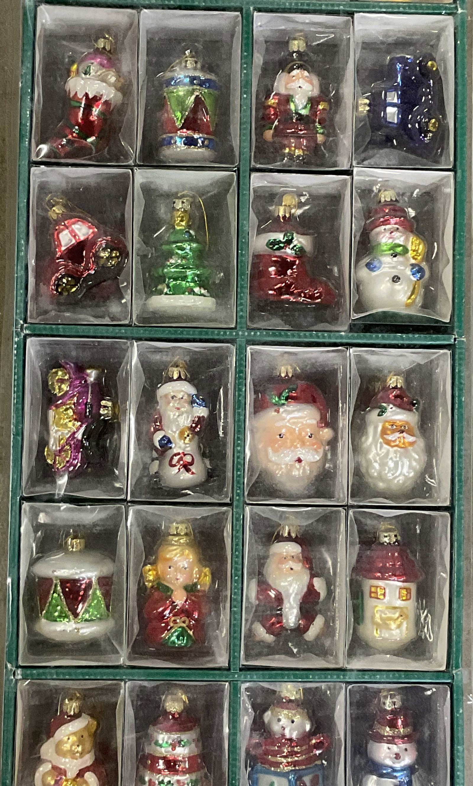 New in Box Glass Christmas Ornaments, Santa +: New in Box Glass Christmas Ornaments. Includes Santa, Snowmen, Angels, and more. Multicolored pieces. Not examined out of packaging. Box measures approx. 33.5L x 11.25W x 5D in. Wear to packaging, los