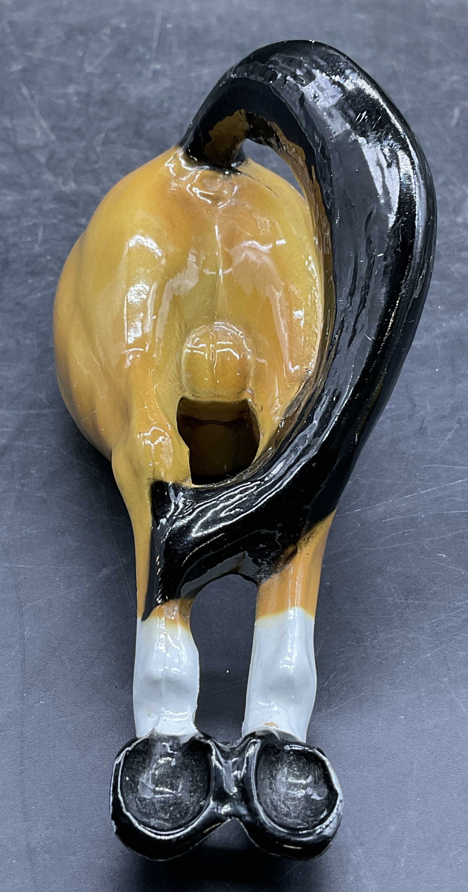 SCOTT PROD. INC. Enamel Horse Behind Bottle Opener: SCOTT PROD. INC. Enamel Horse Behind Bottle Opener. Enameled metal. Reverse reads SCOTT PROD. INC. NEWWARK, NJ, BOTTLE OPENER. Measures approx. 2.5H x 5.5L x 2W in. Losses to finish, surface wear, and
