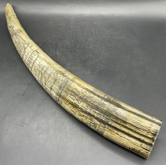 Resinous Nautical Motif Scrimshaw Tusk Statue: Resinous Nautical Motif Scrimshaw Tusk Statue. Measures approx. 22L x 3W in. Reads SHIP JAMES ALLEN, DM, LIBERTY. Discoloration, surface wear, and imperfections to the piece. home decor, home accents,