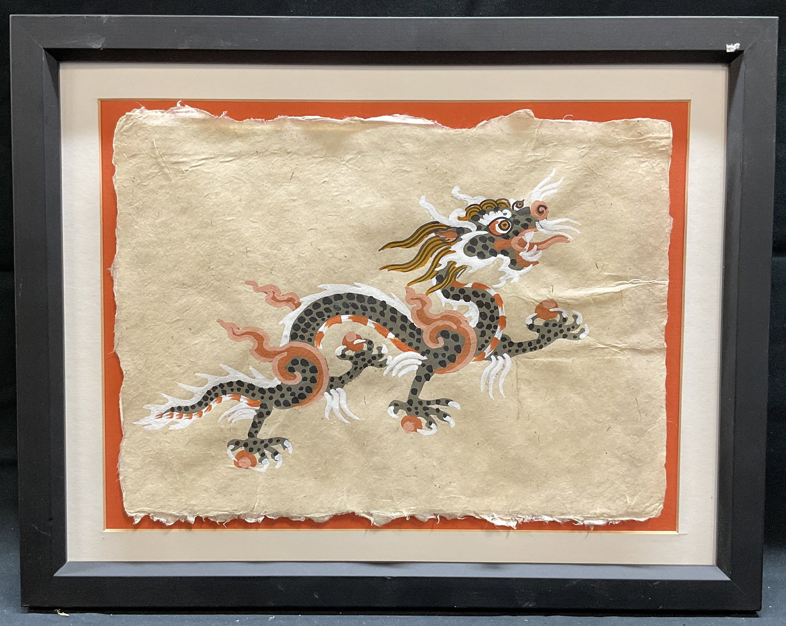 Framed Chinese Dragon Gouache Painting: Framed gouache painting on paper. Chinese dragon in red, grey, and black. Mounted paper with mat. Framed in black wood frame. Not examined out of frame. Measures approx 12 x 15.25 inches (frame). Some