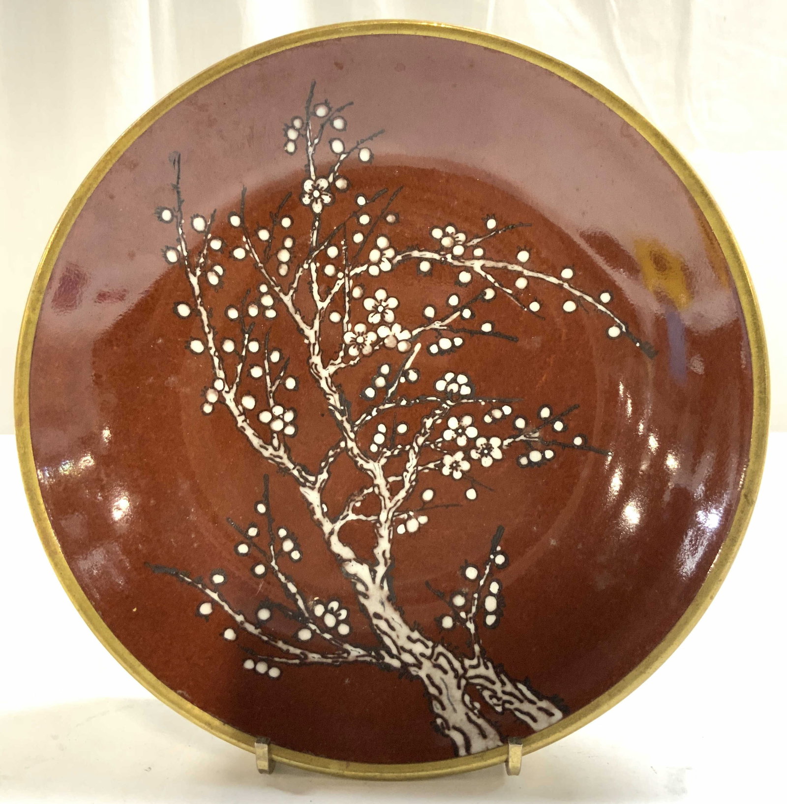 ACF Japanese Porc Bowl W Gilt Metal Casing: Underside is marked ACF JAPANESE PORCELAINWARE. Bowl is porcelain. Piece has gilt metal casing. Interior is red with floral & branch detail. Bowl measures approximately 7.75 inches diameter 1.5 inches