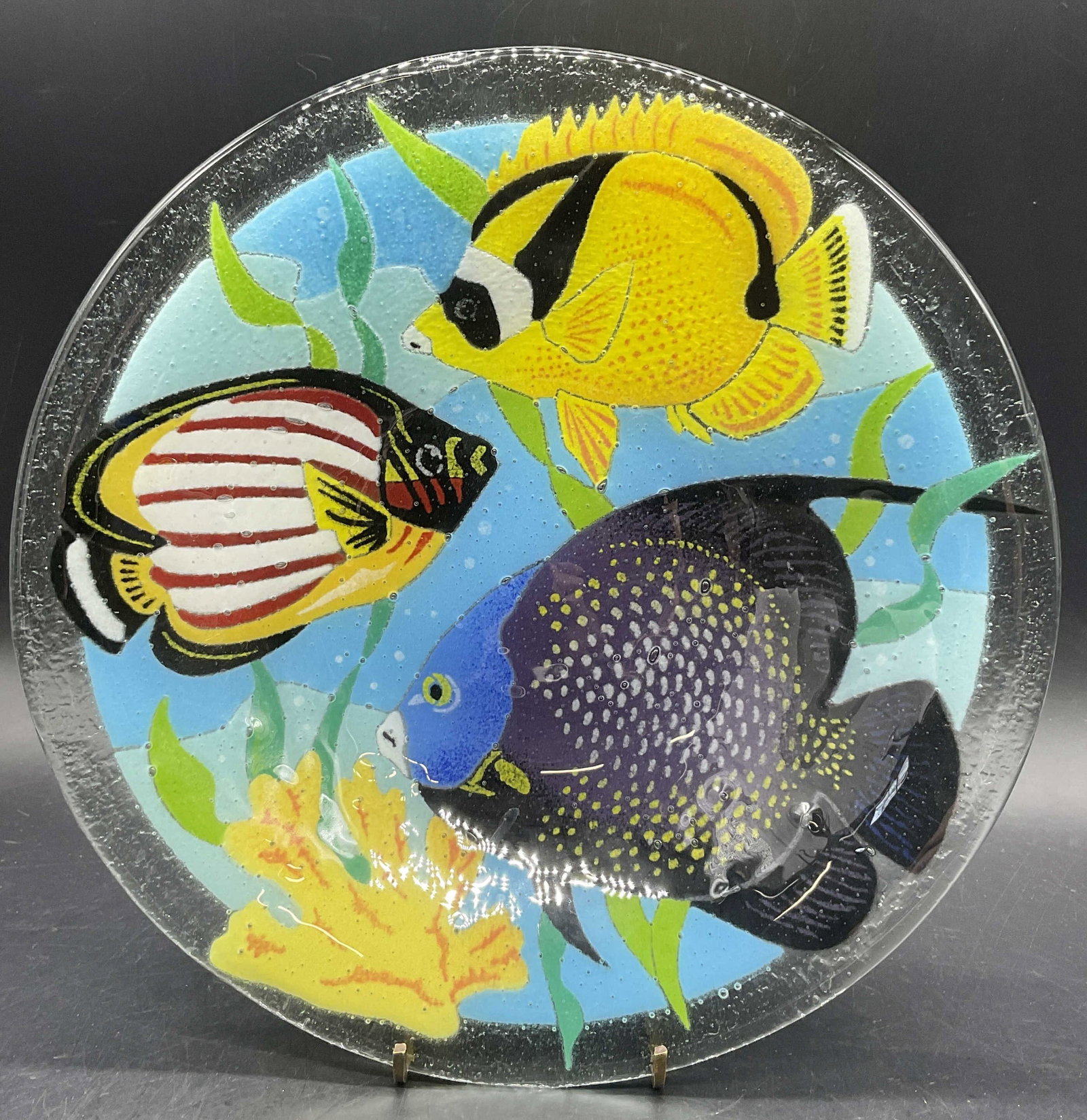 Signed Multicolored Fish Motif Art Glass Bowl: Multicolored Fish Motif Art Glass Bowl. Bubble design throughout the glass. Reverse is textured. Signed on the rim, illegible. Measures approx.1.75H x 10.75W in. Surface wear present. home decor, home