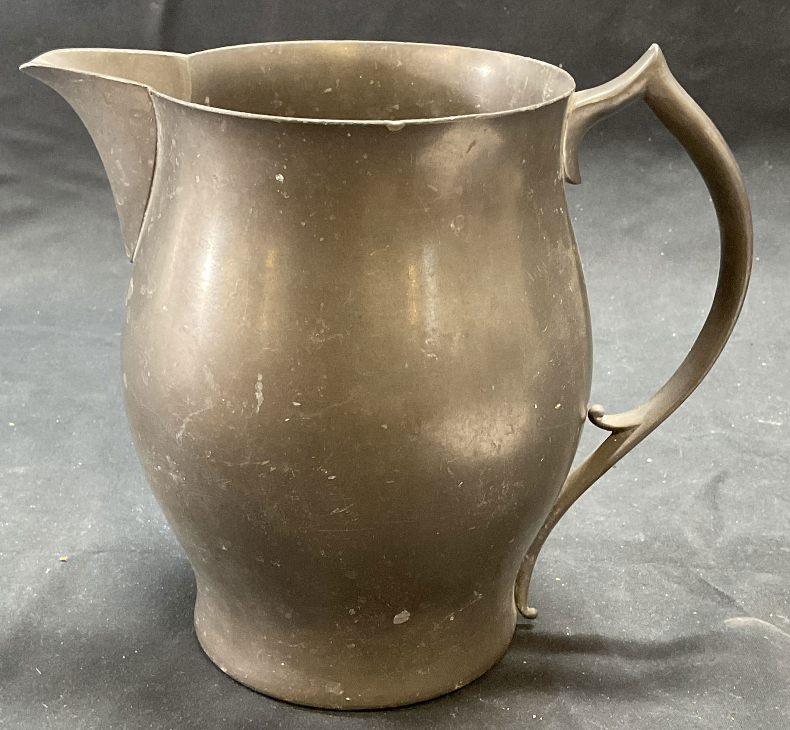 Vintage Revere Pewter by Benedict Pitcher: Vintage Revere Pewter by Benedict pitcher. Piece has weight. Signed on underside. Measures approx. 7.5 x 5 x 6.75 inches. Some surface wear including scratching observed. Revere pewter by Benedict, re