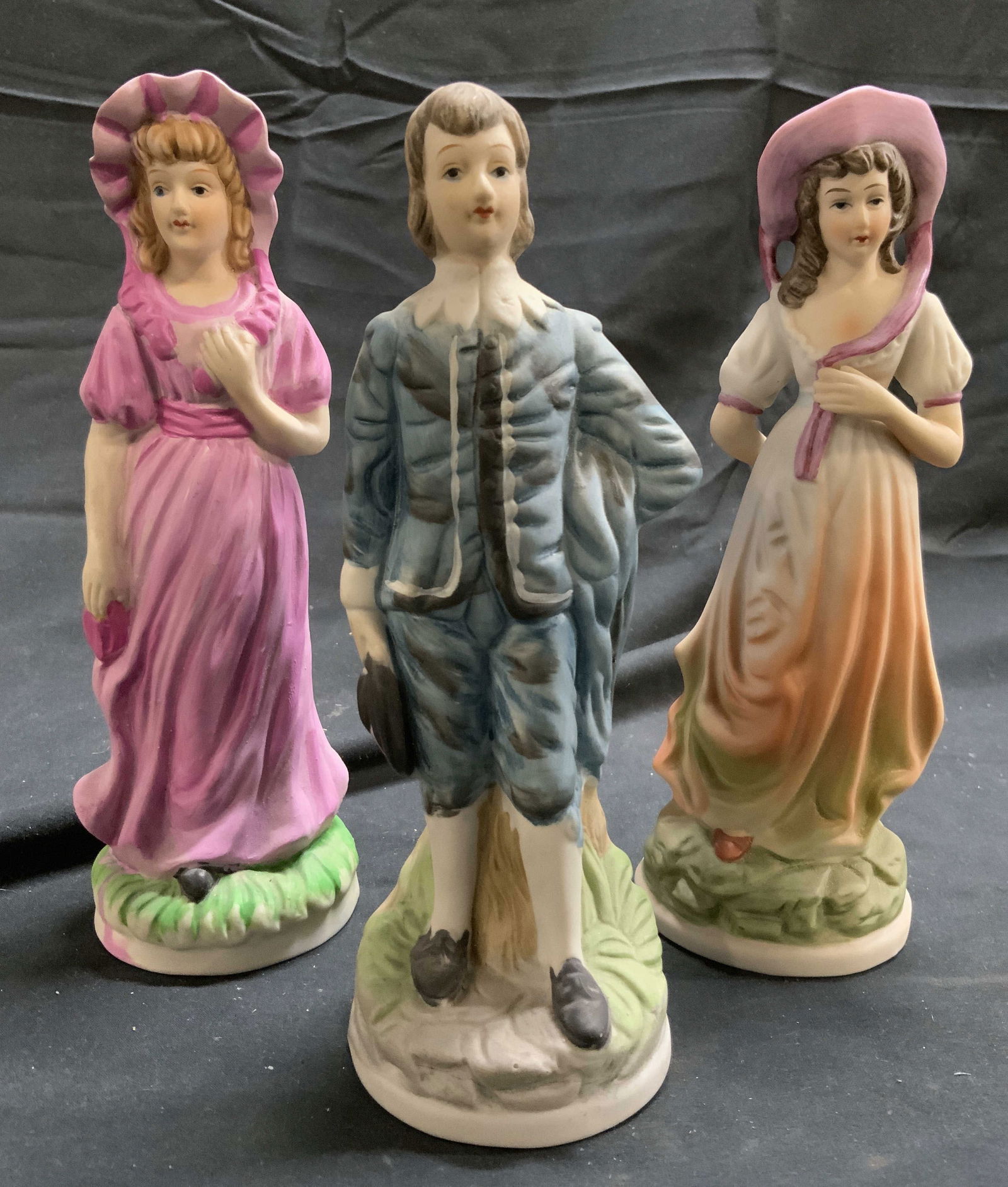 Lot 3 Vintage Porc Male & Female Figures: Lot includes 2 female figures and 1 male figure. Each piece appears to be porcelain possibly bisque. Some elements appear to be hand painted. Largest figure measures approximately 8 inches tall 2.75 i