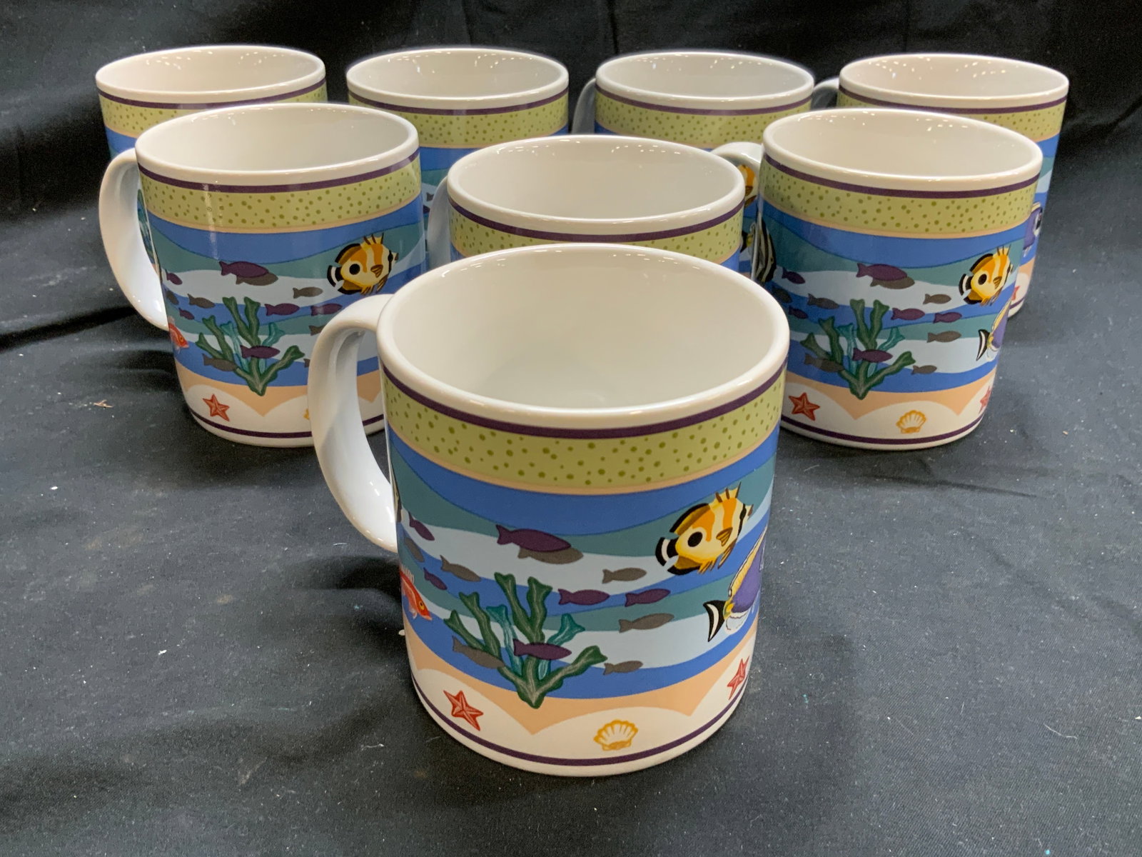 CLAIRE MURRAY SAKURA CORAL REEF 8 Porc Mugs: Undersides are marked CLAIRE MURRAY SAKURA CORAL REEF. Lot includes 8 mugs. Mugs are porcelain. Each have multi toned underwater, fish & other sea-life detail. Mugs each measure approximately 3.5 inch