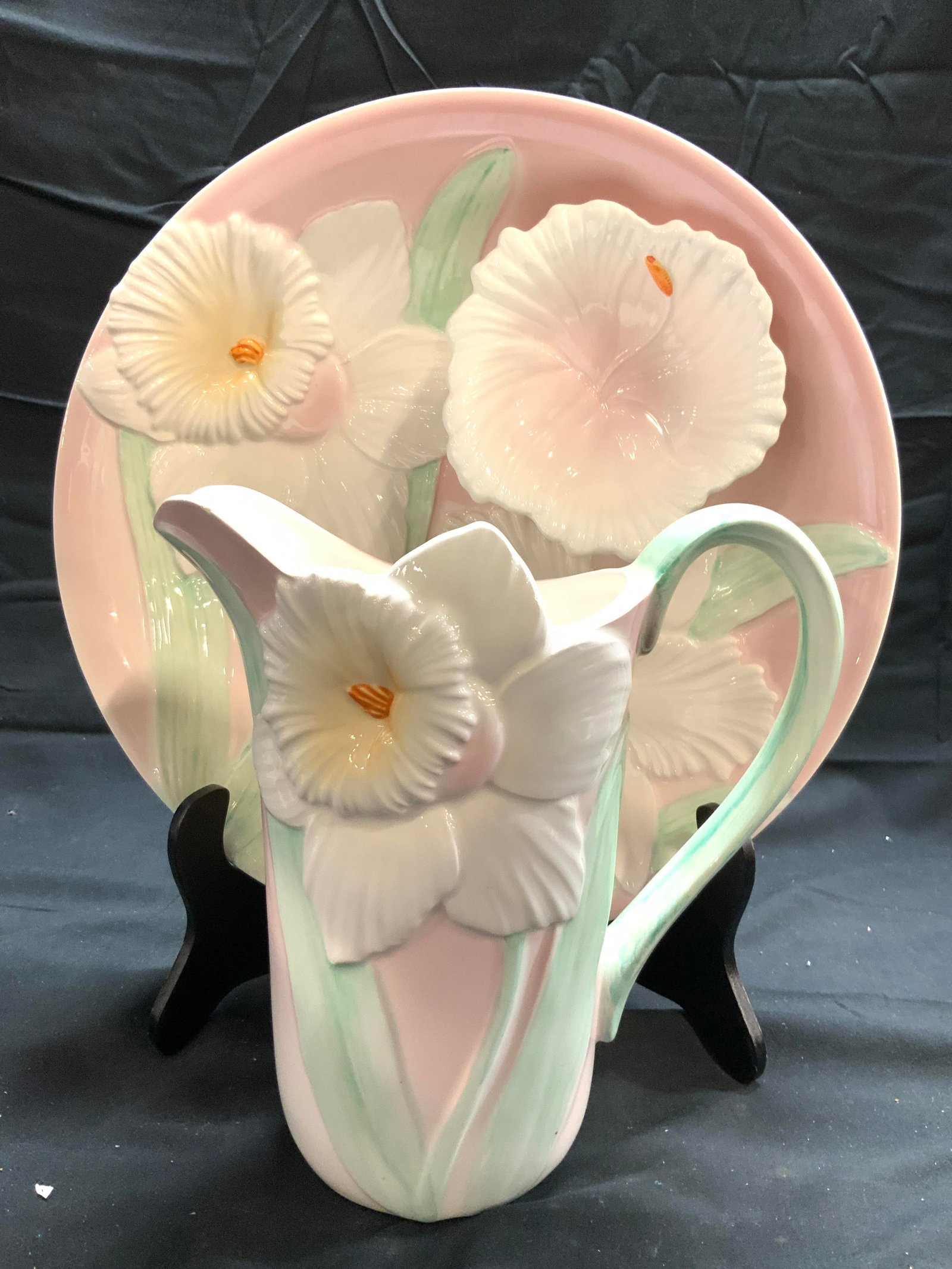 OTAGIRI FIGI GRAPHICS Pitcher & Chip & Dip Bowl: Undersides read FIGI GRAPHICS. Lot includes 1 chip and dip bowl and 1 pitcher. Each piece is porcelain. Pieces each have white, green & pink toned floral and leaf detail, some areas beveled. Chip and 