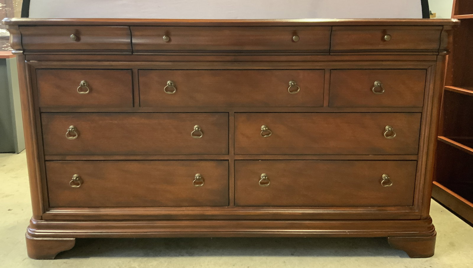 Vintage 10 Drawer Wooden Buffet Sideboard: Buffet is tan toned and wooden. Piece is vintage. Buffet has 10 drawers, each with gilt metal handles. Measures approximately 68 inches long 38 inches tall 19 inches deep. Buffet, sideboard, wooden bu