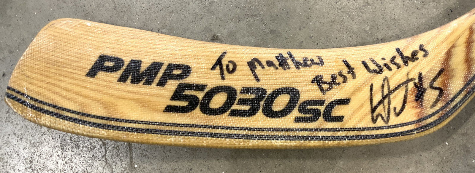 Signed Wooden Sherwood PMP5030 SC Hockey Stick: Stick blade is signed illegibly. Piece is tan and black toned. Stick is wooden. Piece is trademarked SHERWOOD PMP5030SC. Hockey stick measures approximately 64 inches tall 8 inches deep. Hockey stick,