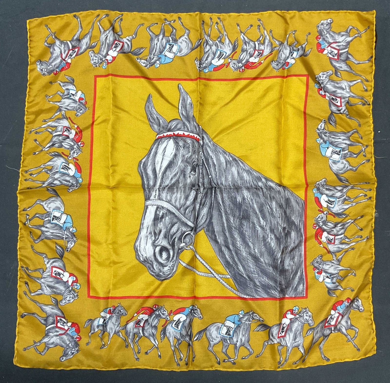 Dumont Horse Jockey Equestrian Silk Scarf Italy: Dumont equestrian motif horse and jockey silk scarf in gold. Made in Italy. Hand rolled edges. Measures approx 17 x 18 inches. Some wear consistent with exposure. Scarf, silk scarf, accessories, fashi
