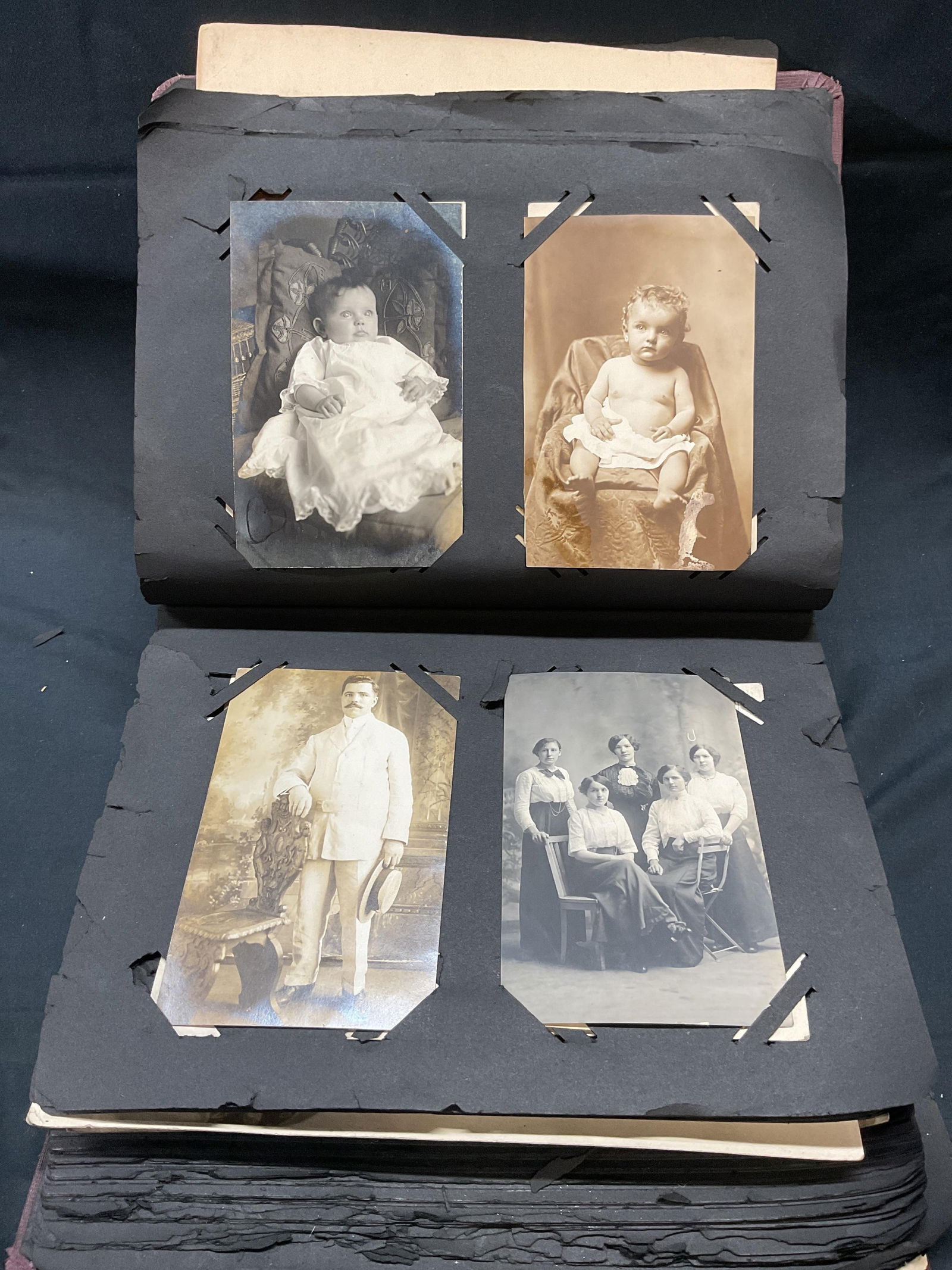 Group Lot Antique Postcard & Photograph Album: Group lot of 25+ antique postcards and photographs in album. Many photographs appear to be gelatin silver prints. Date ranges from early 20th century, some possibly older or more recent. Some postcard