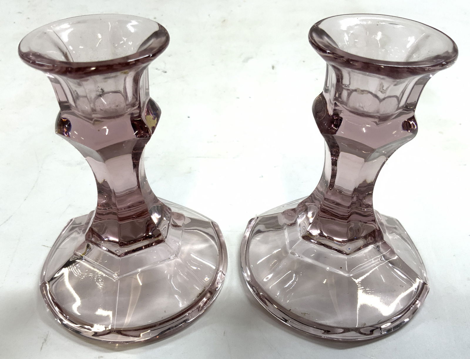 Pair Art Glass Candlesticks Purple: Lot includes 2 candlesticks. Each are purple toned and glass. Candlesticks each Measure approximately 4.25 inches tall 3.25 inches wide. Candlesticks, purple candlesticks, glass candlesticks, art glas