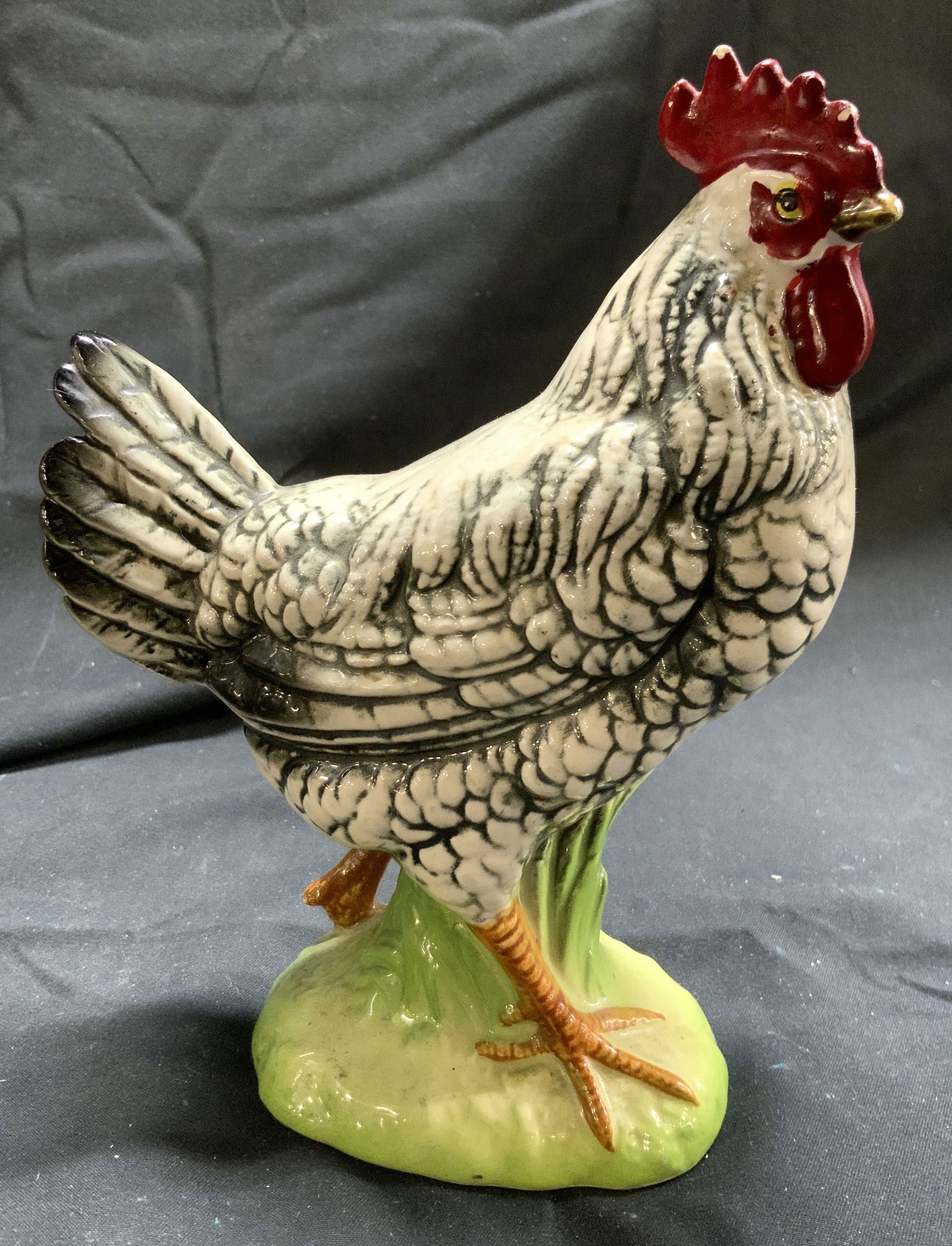Hand Painted Porc Rooster Figure: Tag on underside reads C 6967. Piece is hand painted and porcelain. Figure depicts a rooster. Piece measures approximately 6.5 inches tall 4.75 inches deep 2.5 inches wide. Rooster figure, hand painte