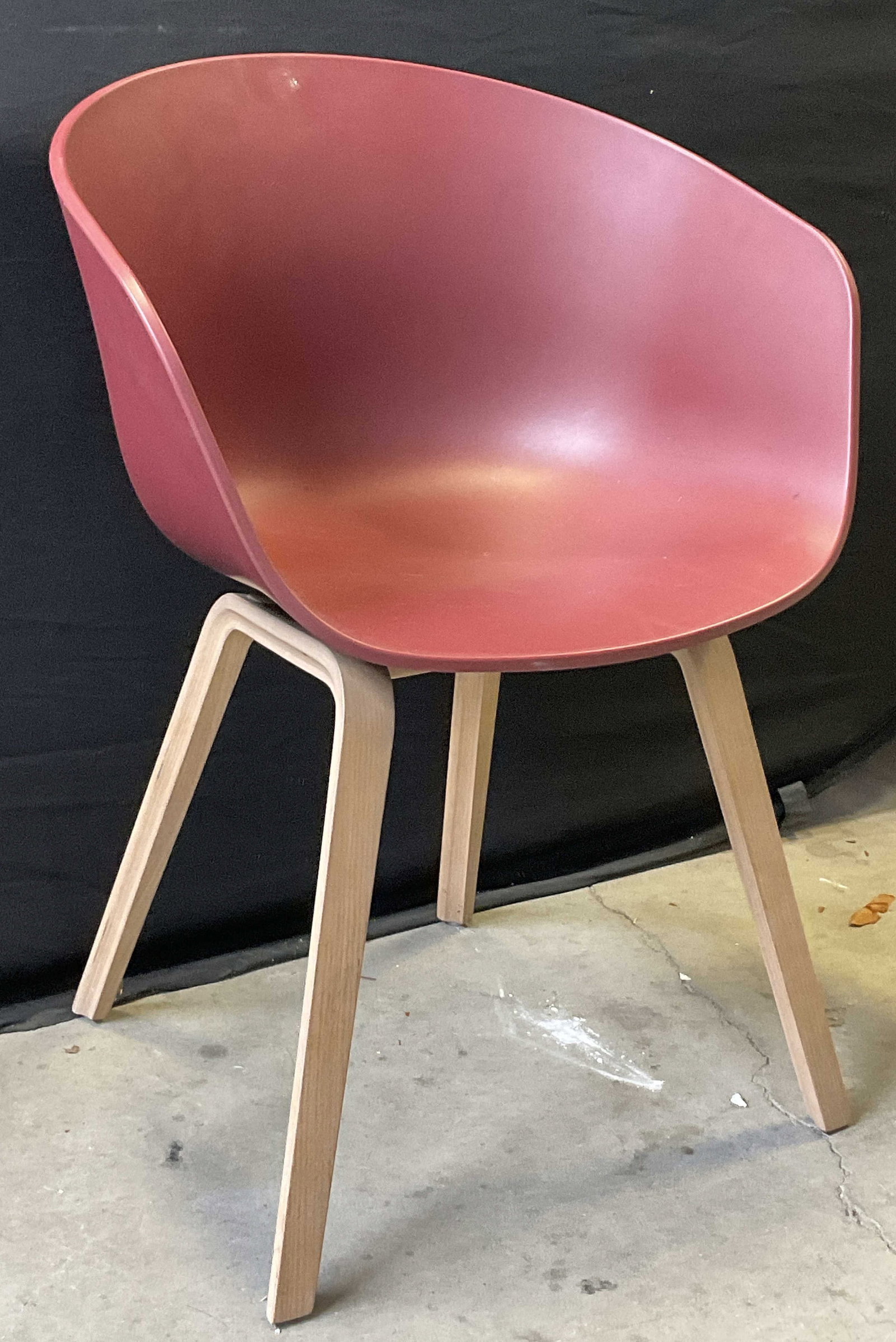 HAY ABOUT A CHAIR Red Danish Modern Style Chair: HAY ABOUT A CHAIR Red Danish Modern Style Chair. Red polypropylene seat and wooden legs. Underside reads HAY. Measures approx. 23W x 18.25D x 31.5H in. Surface wear, discoloration, and chipping presen