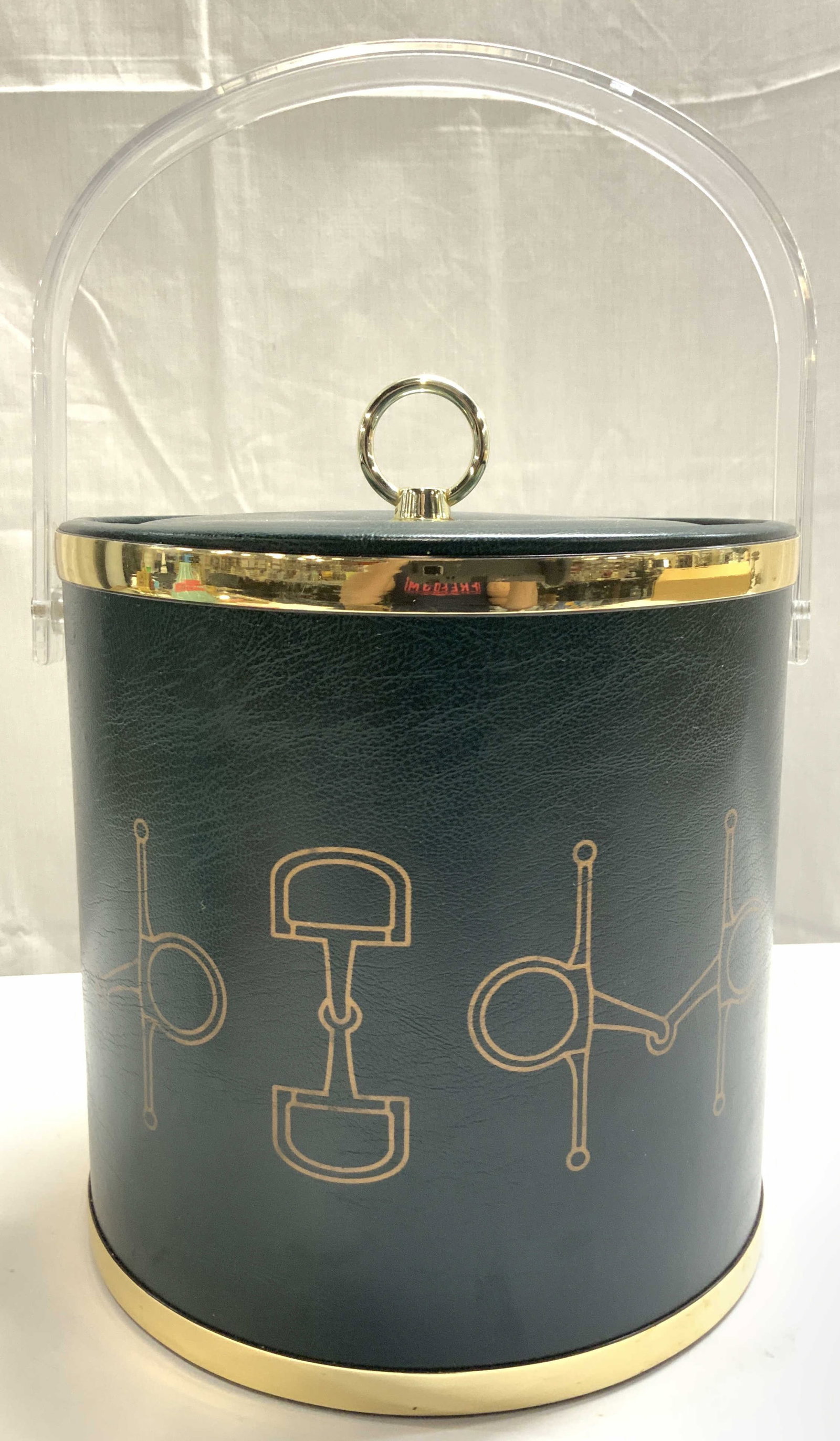 Leatherette Lined Ice Bucket w Lid & Handle USA: Underside reads MADE IN USA. Ice bucket is lined in dark green toned leatherette material. Bucket includes lined lid and silver toned metal loop handle. Bucket also has arch form acrylic handle. Outer