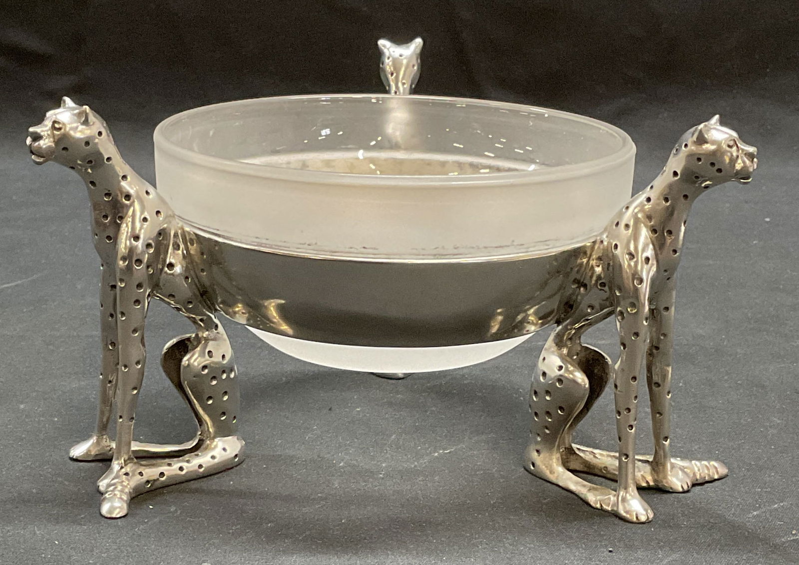 Diana Carmichael Cheetah Tripod Stand Bowl: Diana Carmichael cheetah bowl. Pewter and glass. Tripod cheetah figural stand with frosted glass insert. Signed DC on metal. Stand measures approx 6.5 x 3.75 inches. Bowl measures approx 4.75 x 2.25 i