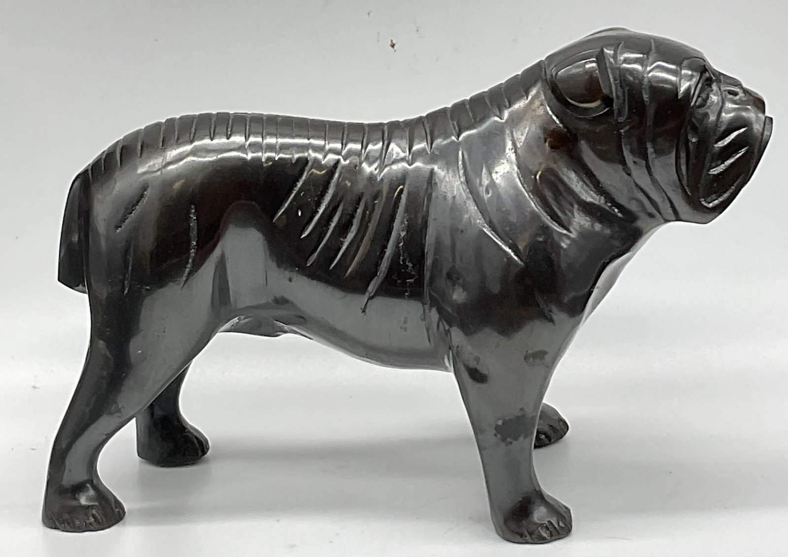 Vintage Bronze Bulldog Statue: Vintage Bronze Bulldog Statue. Crafted from metal, appears to be bronze. Weighty. Measures approx. 5H x 7W in. Holes to the underside. Patina present. Surface wear consistent with age, use, and exposu