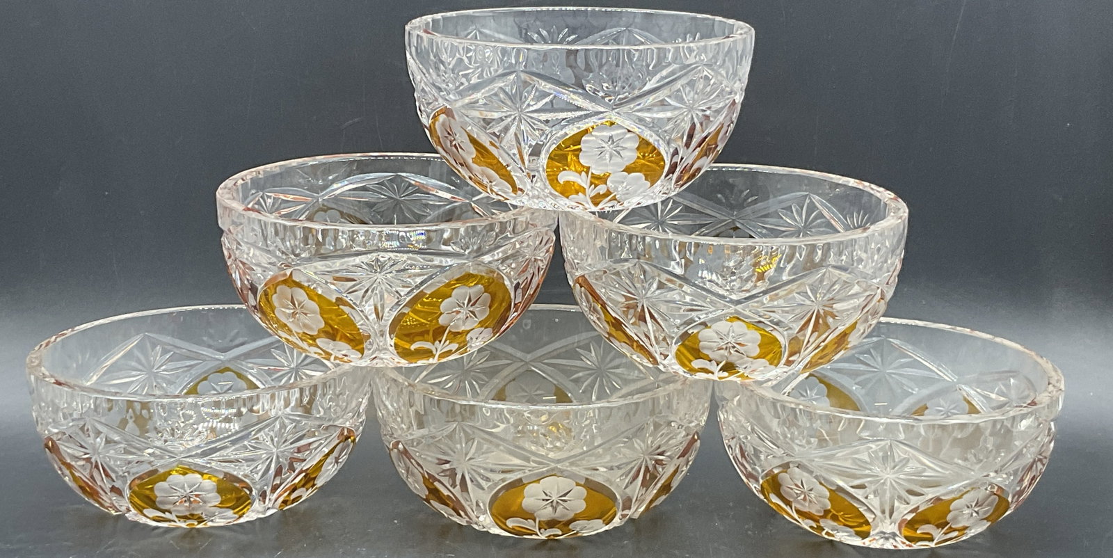 Set 6 Clear & Amber Floral Motif Crystal Bowls: Set of 6 Clear & Amber Floral Motif Crystal Bowls. Thick walled and weighty. Measures approx. 2.5H x 5.25W in. Surface wear, chipping, and residue present. Bubbles to crystal. home decor, home accents