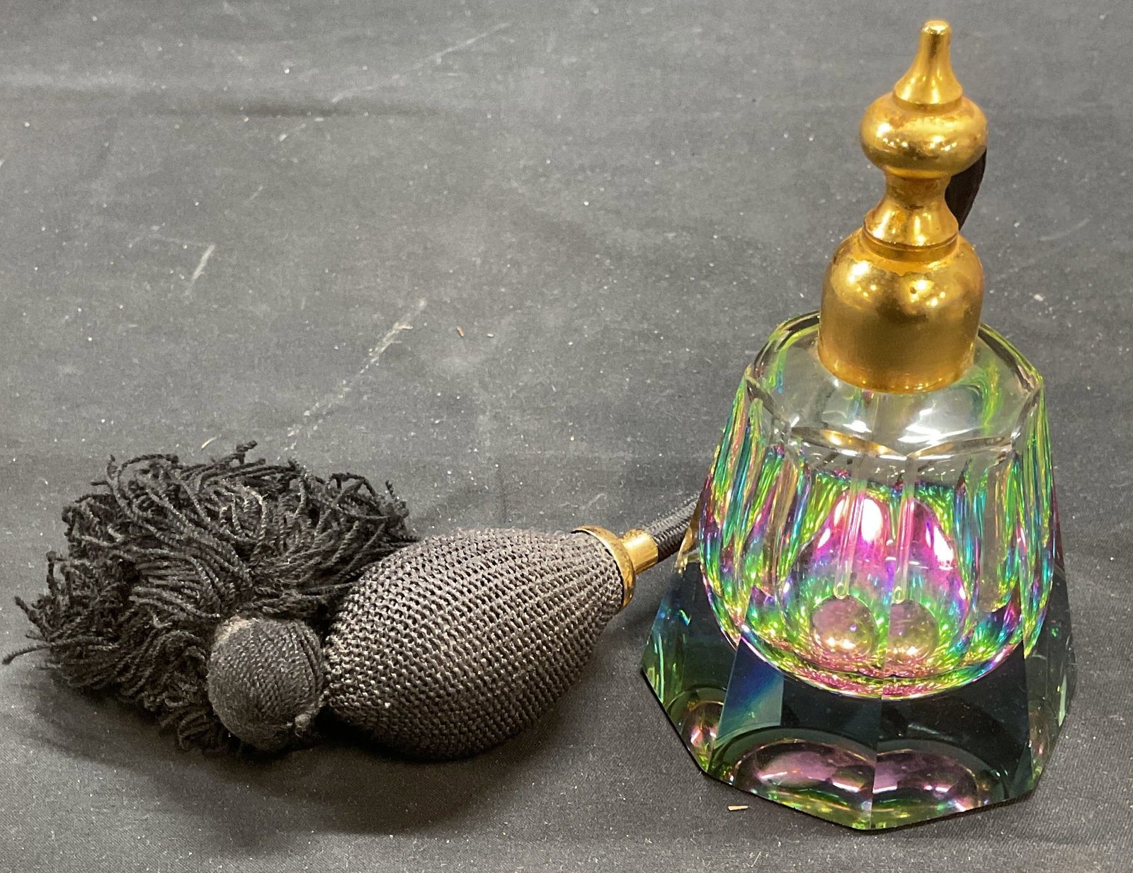 BREVETE Art Glass Prism Perfume Bottle France: Marcel Franck BREVETE SGDG art glass prism perfume bottle. Faceted tapered shape bottle with prismatic effect. Silver tone base. Black atomizer. Signed on metal. Made in France. Measures approx 2.75 x