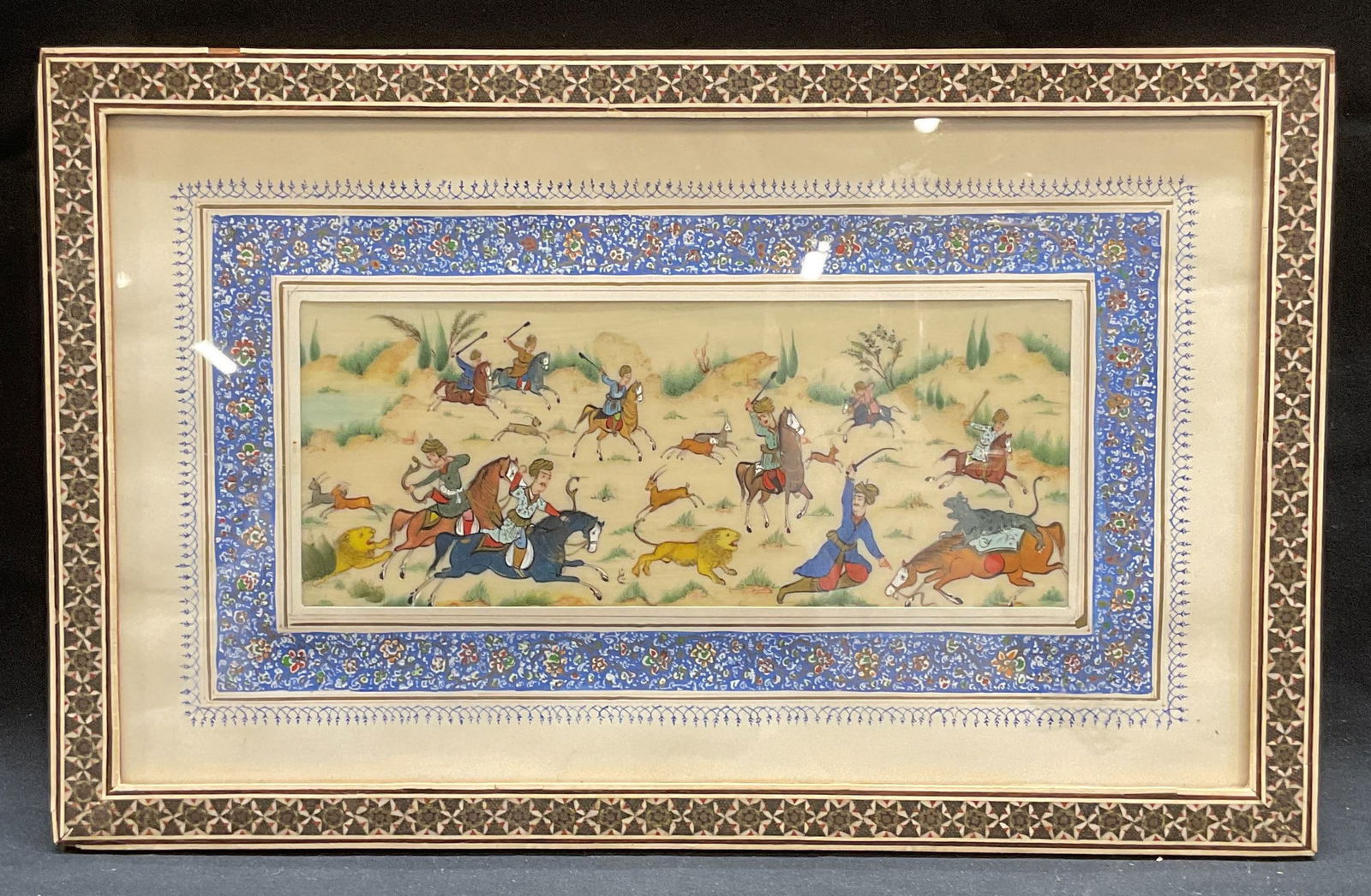 Framed Persian Miniature Polo Game Painting: Framed Persian miniature painting. Appears to be on bone, possibly tempera or watercolor. Scene depicting a polo game with men on horseback. Framed and matted in Khatam inlay marquetry frame. Decorati