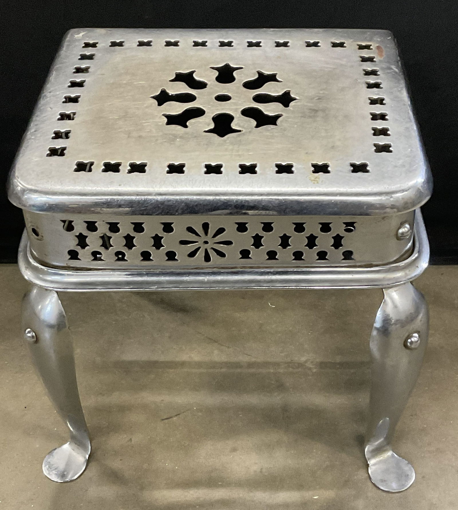 Vintage Pierced Silver Tn Metal Fireplace Footman: Vintage Pierced Silver Tone Metal Fireplace Footman / Fireplace Bench. Measures approx. 13.5H x 12D x 14W in. Discoloration, residue, wobble to piece, and surface wear present. home decor, home accent