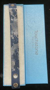 Swarovski Touchstone Crystal Blue Bracelet: Touchstone by Swarovski blue bracelet with colorless and blue crystal accents. Includes box. Measures approx 8.5 inches long. Some wear including scratching observed. Jewelry estate jewelry, costume j