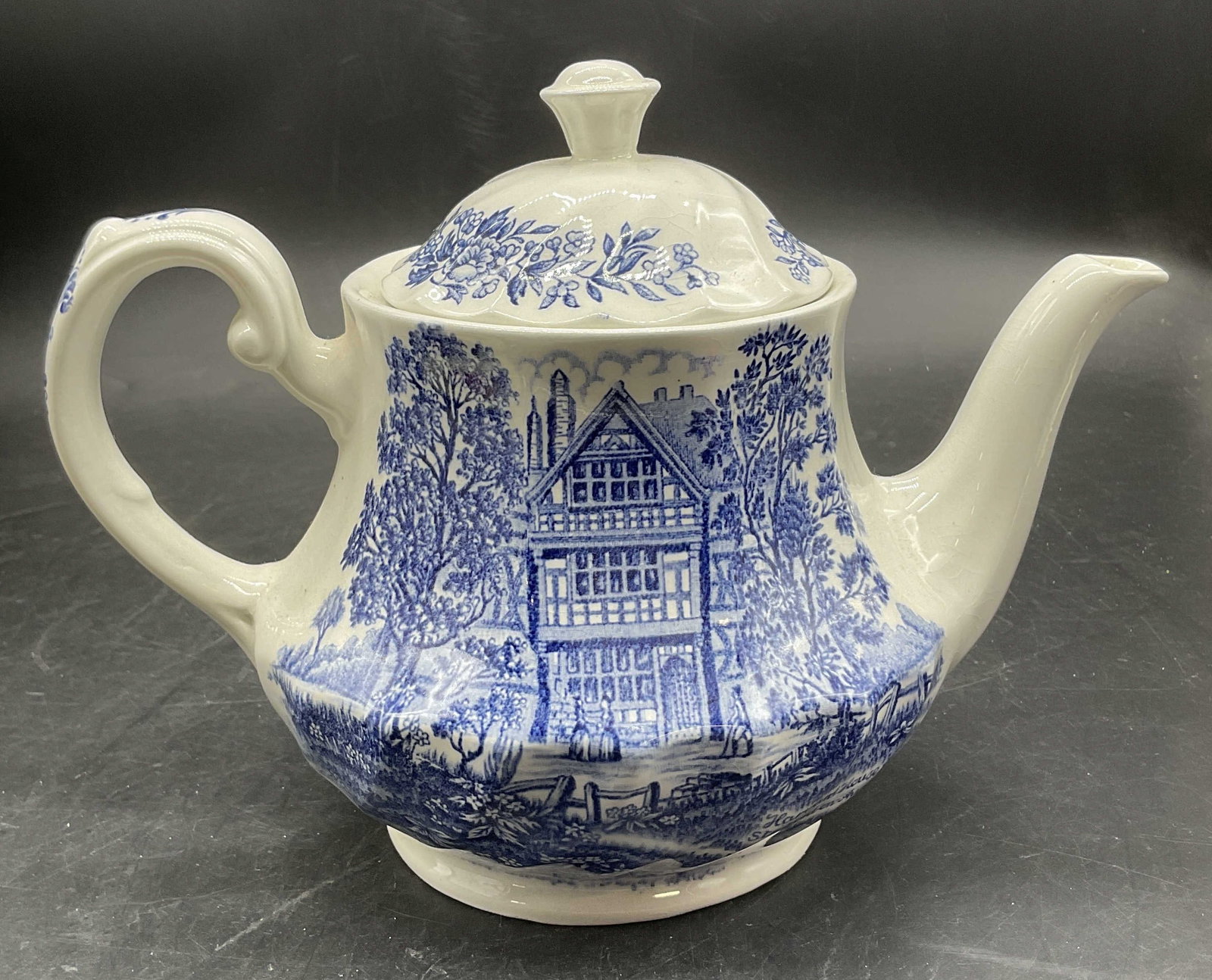 ROYAL ESSEX IRONSTONE Vintage Blue & White Teapot: Vintage Blue & White Shakespeares Country ROYAL ESSEX IRONSTONE Teapot. Underside is stamped Shakespeares Country, Royal Essex Ironstone, England. Lidded. Measures approx. 8.5W x 6.5H in. Measured at 