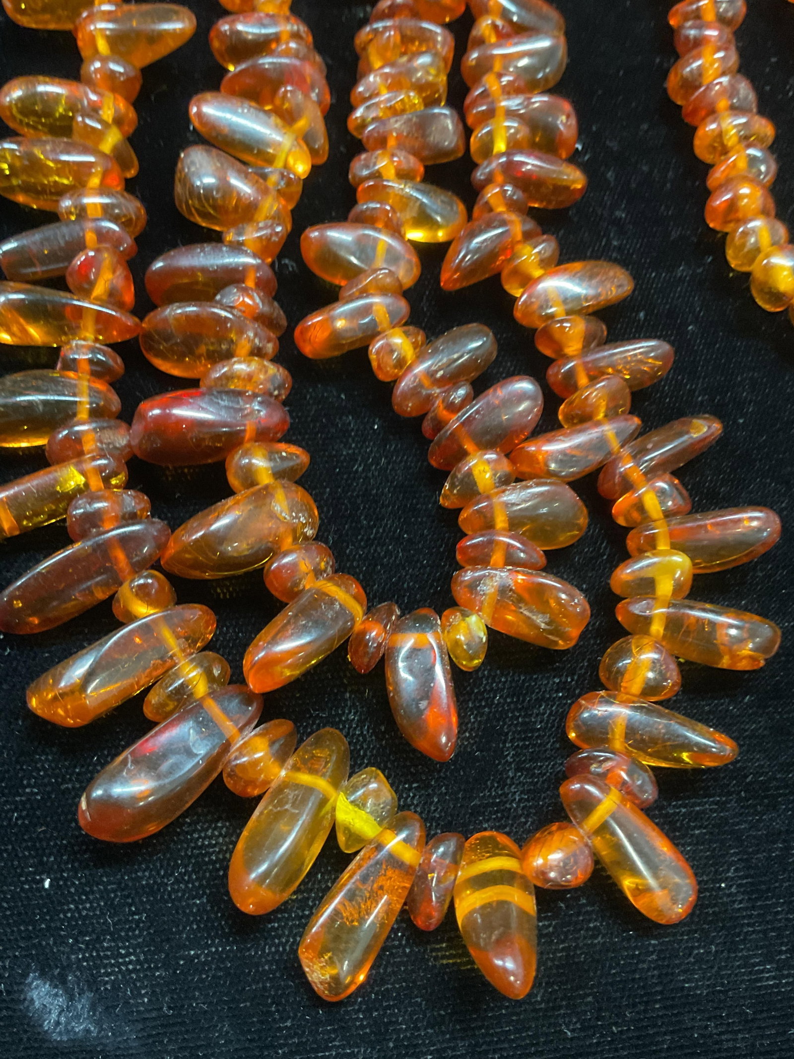 Vintage Amber Nugget Beaded Necklace: Vintage translucent golden amber nugget beaded double strand necklace. Drop length approx 13 inches. Some wear including scratching and crazing observed. Jewelry, estate jewelry, costume jewelry, fash