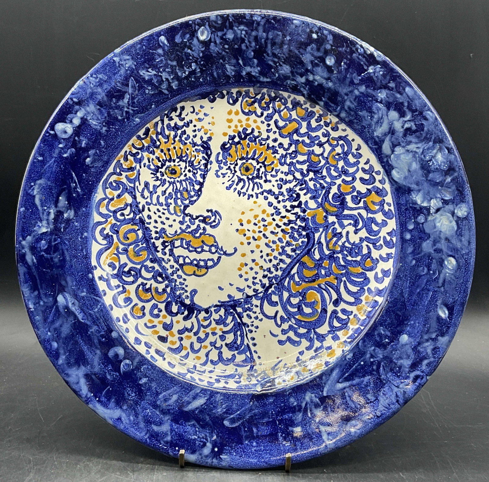 Vtg Signed Hand Painted Female Face Pottery Plate: Vintage Signed Hand Painted Female Face Motif Pottery Plate. Primarily blue, white, and yellow hues. Signed on obverse, possibly reads F. Sihak, partially illegible. Impressions to the underside, ille
