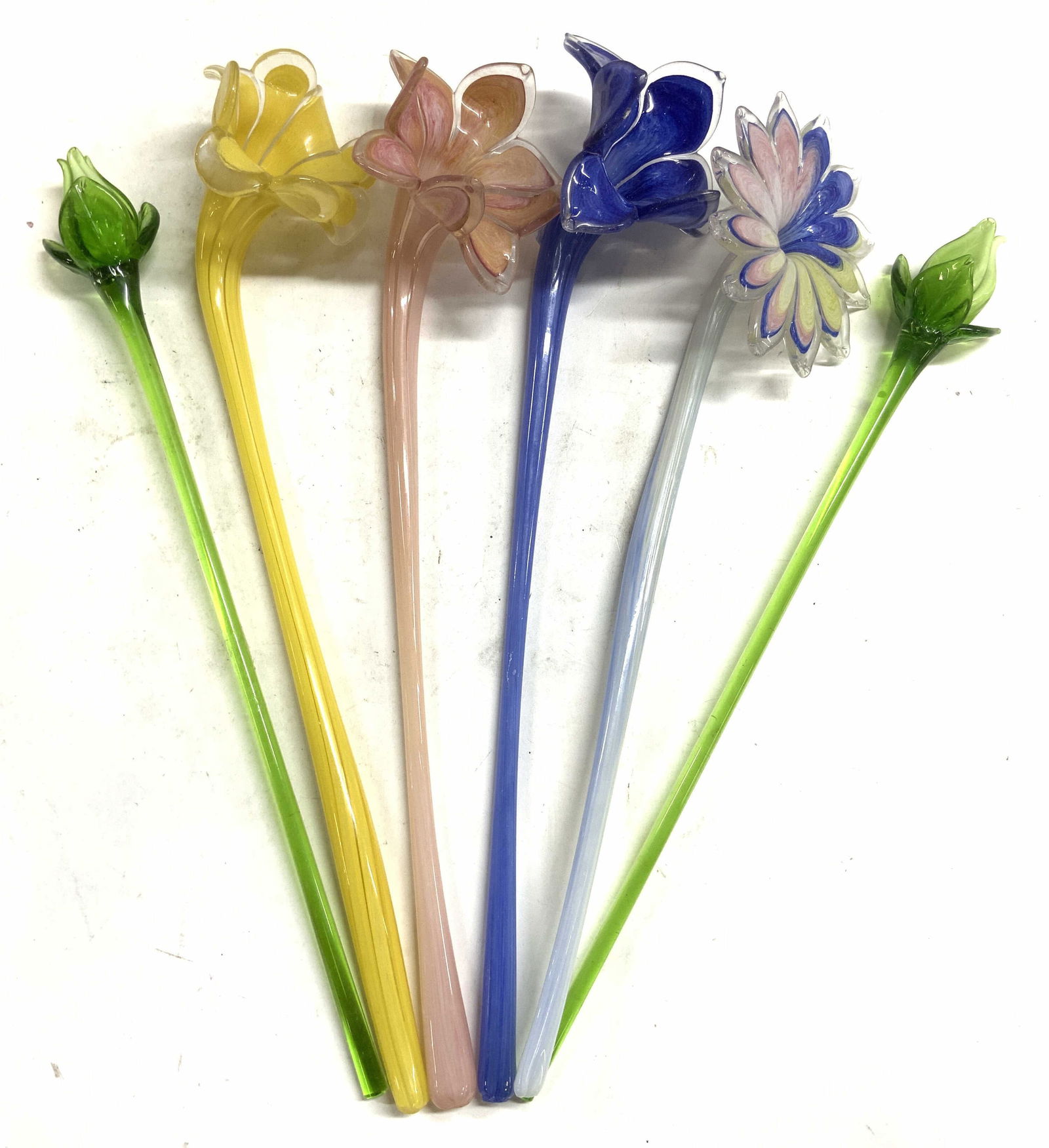 MURANO Lot 6 Long Stem Art Glass Flowers: Lot includes 6 Art glass flowers. Each appear to be MURANO glass (no apparent markings). Including 2 green, 1 blue, 1 yellow, 1 pink, & 1 with white stem and multi toned petals. Largest glass flower m