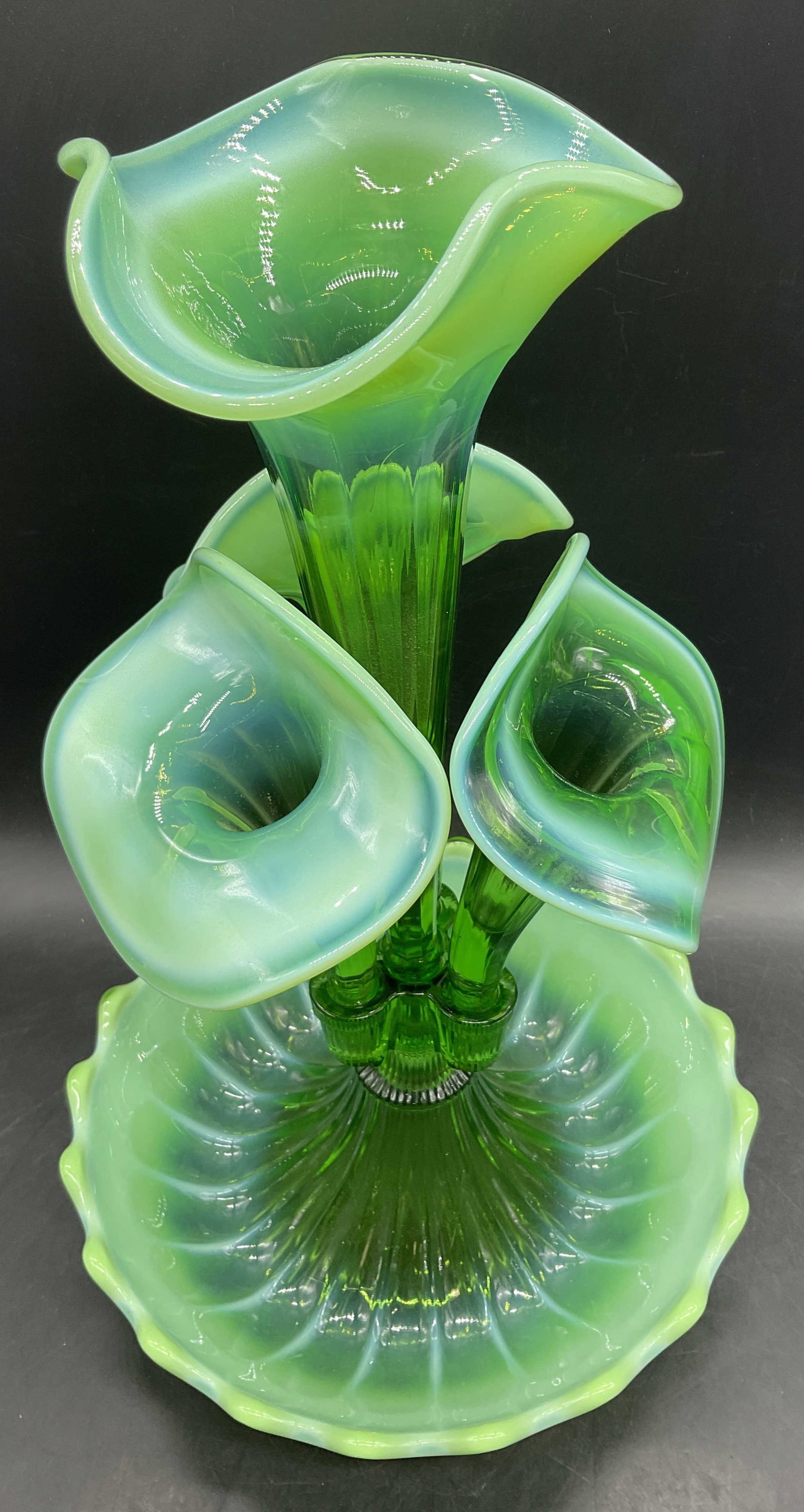 Vintage Green Ombre Glass Epergne: Vintage Green Ombre Glass Epergne. Various green hues to the piece. Clear and opaque. Four removable stems to the center piece. Together pieces measure approx. 16H x 10.5W in. Thick walled glass. Surf