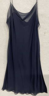 CHANEL Navy Blue Sheer Slip Dress: CHANEL Navy Blue Sheer Slip Dress. Length measured flat approx. 34 inches. Crafted from silk, cotton, polyester, and metal. Tag reads CHANEL, 40. Holes and surface wear present. Tag is loose. Wearable