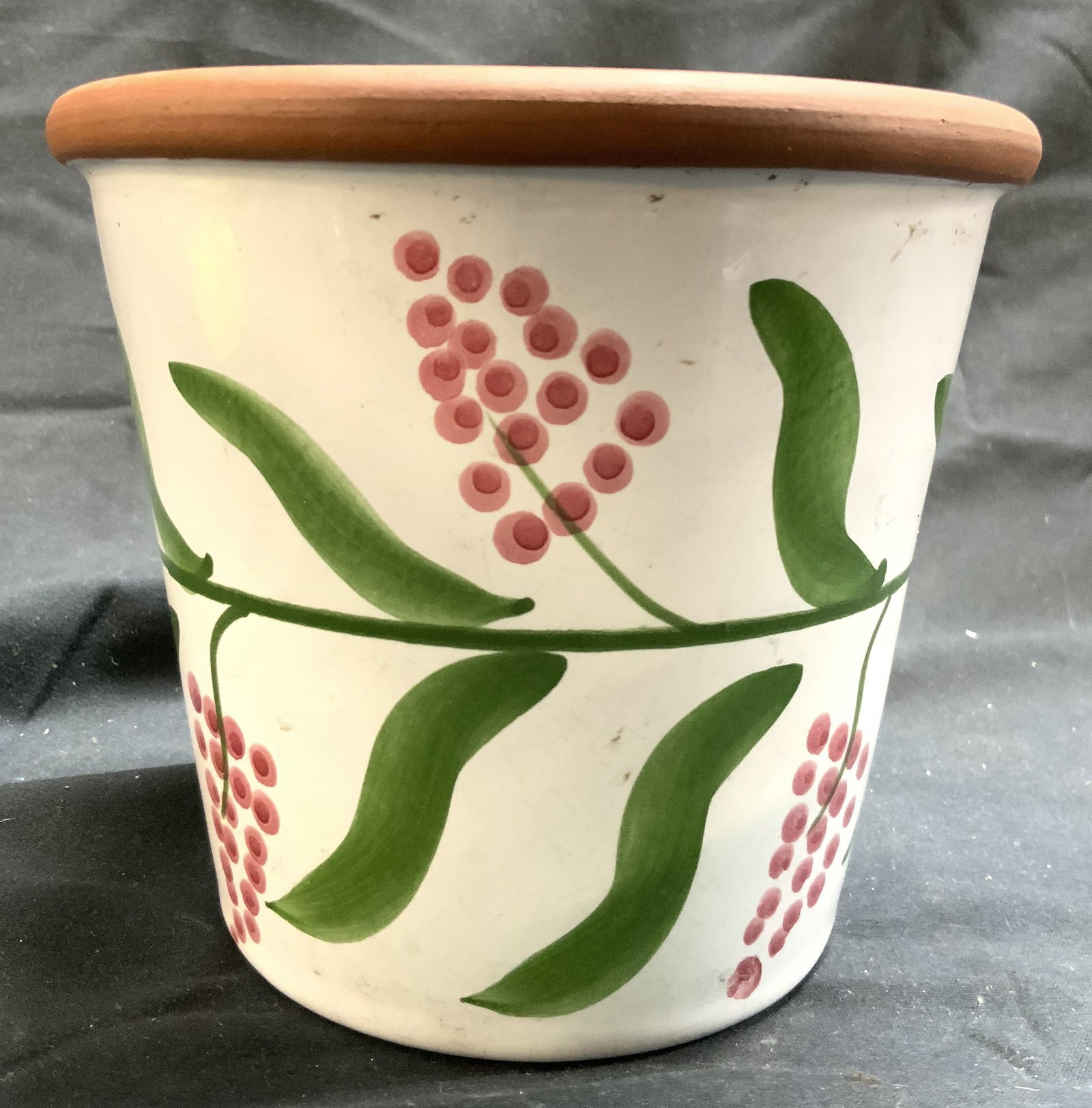 COUNTRYMAN CERAMICS Hand Painted Planter: Underside is marked COUNTRYMAN CERAMICS MADE IN PORTUGAL. Planter has terra cotta interior. Exterior is white with hand painted grape, vine and leaf detail. Outer rim has lip. Piece measures approxima