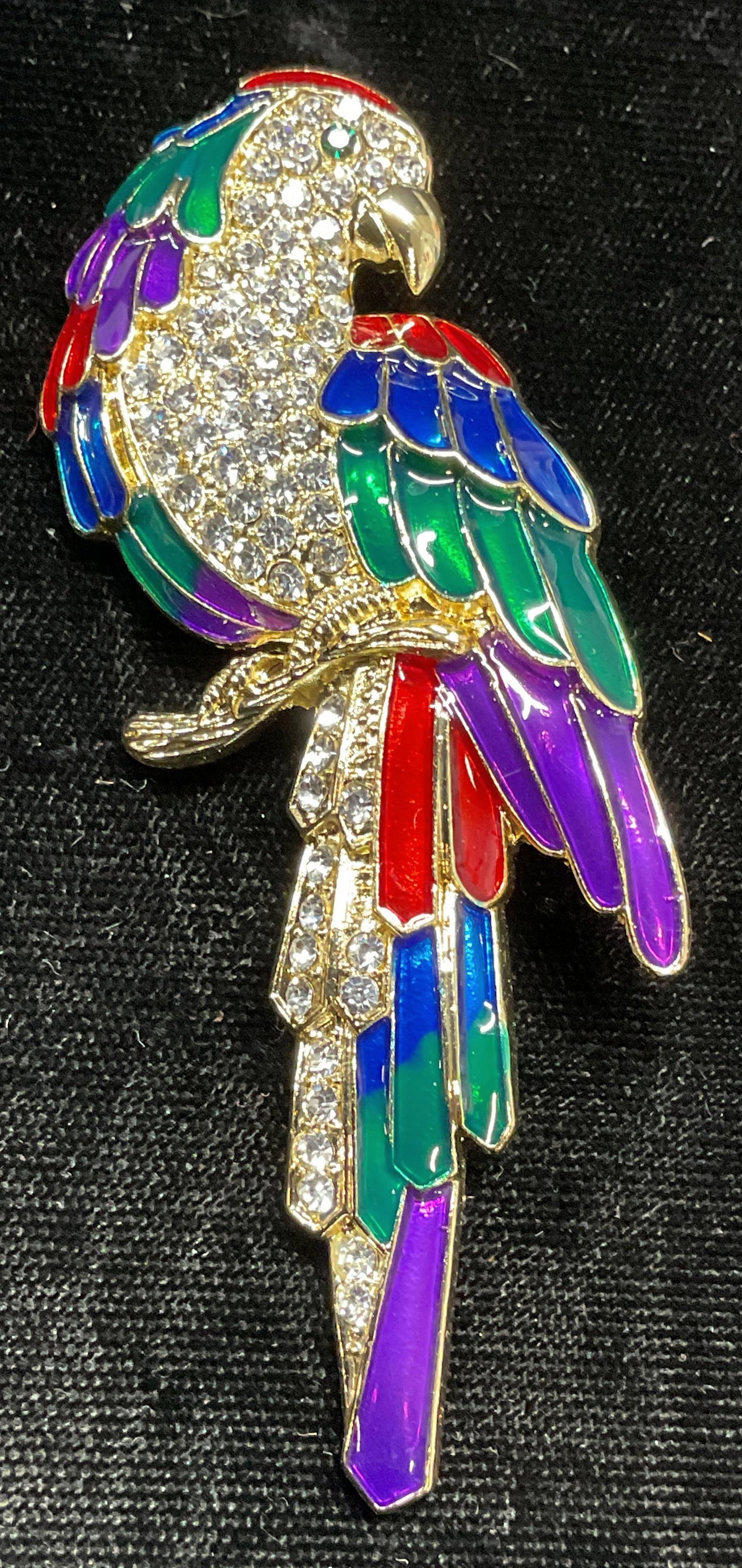 Ali Lang Gold Tone Crystal Enamel Bird Brooch: Ali Lang gold tone crystal and multicolor enamel bird motif brooch. Signed on underside. Hinge pin on underside. Measures approx. 3 x 1.25 inches. Some surface wear including scratching observed. Jewe