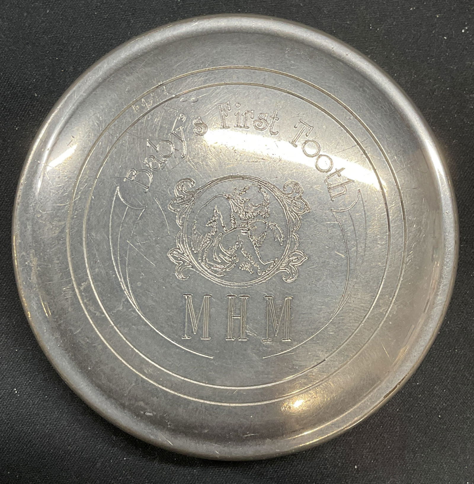 Salisbury Pewter Baby First Tooth Box: Salisbury Babys First Tooth keepsake box. Pewter. Etched child motif and monogram. Signed on underside. Measures approx 3 x .75 inches. Some scratching observed. Salisbury, Salisbury tooth box, tooth