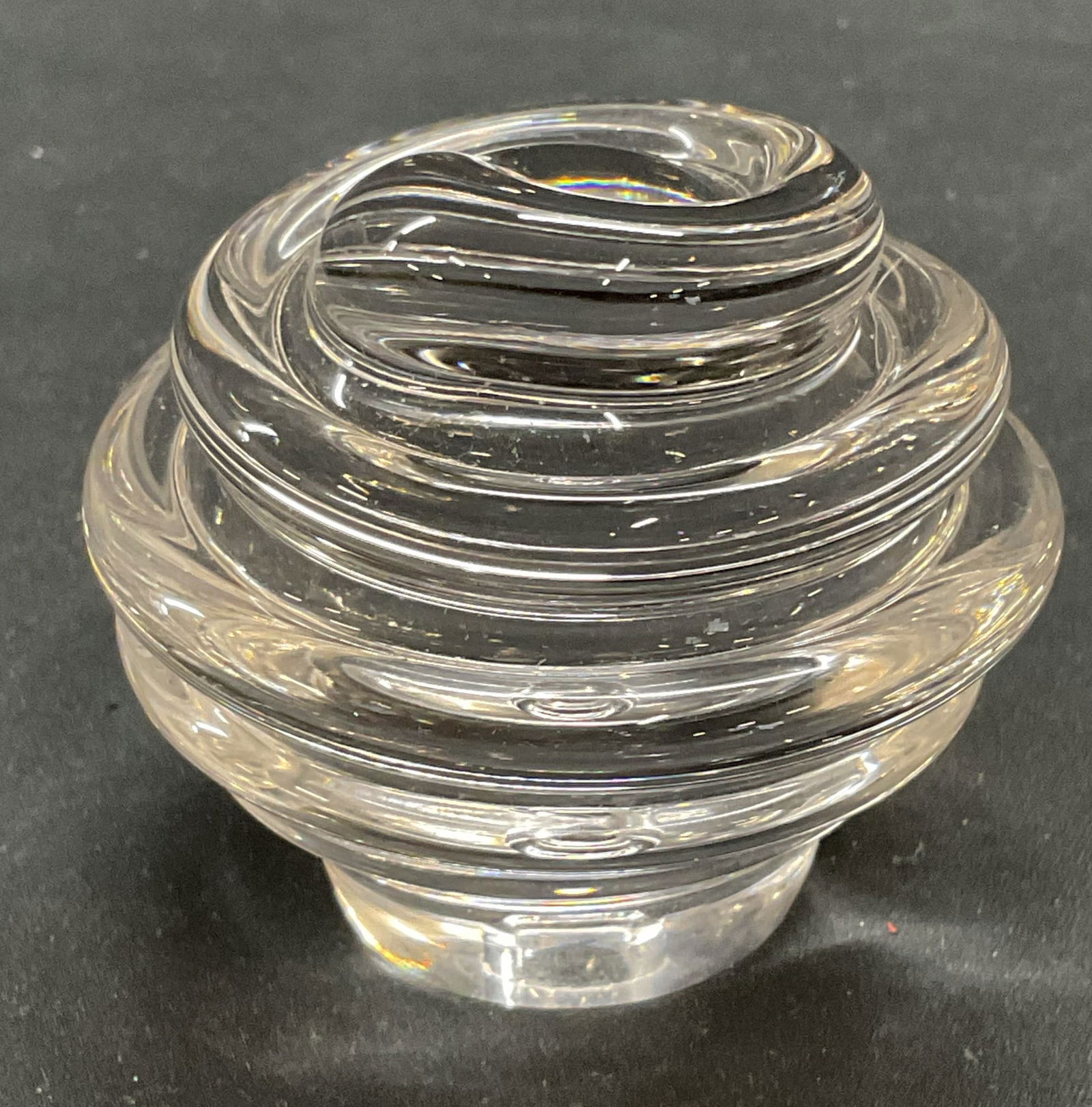 Clear Glass Swirl Paperweight Accessory: Clear glass swirl paperweight or home accessory. Measures approx 2.5 x 2.5 inches. Some wear consistent with exposure. Glass paperweight, swirl paperweight, home accessories, home decor, table accesso